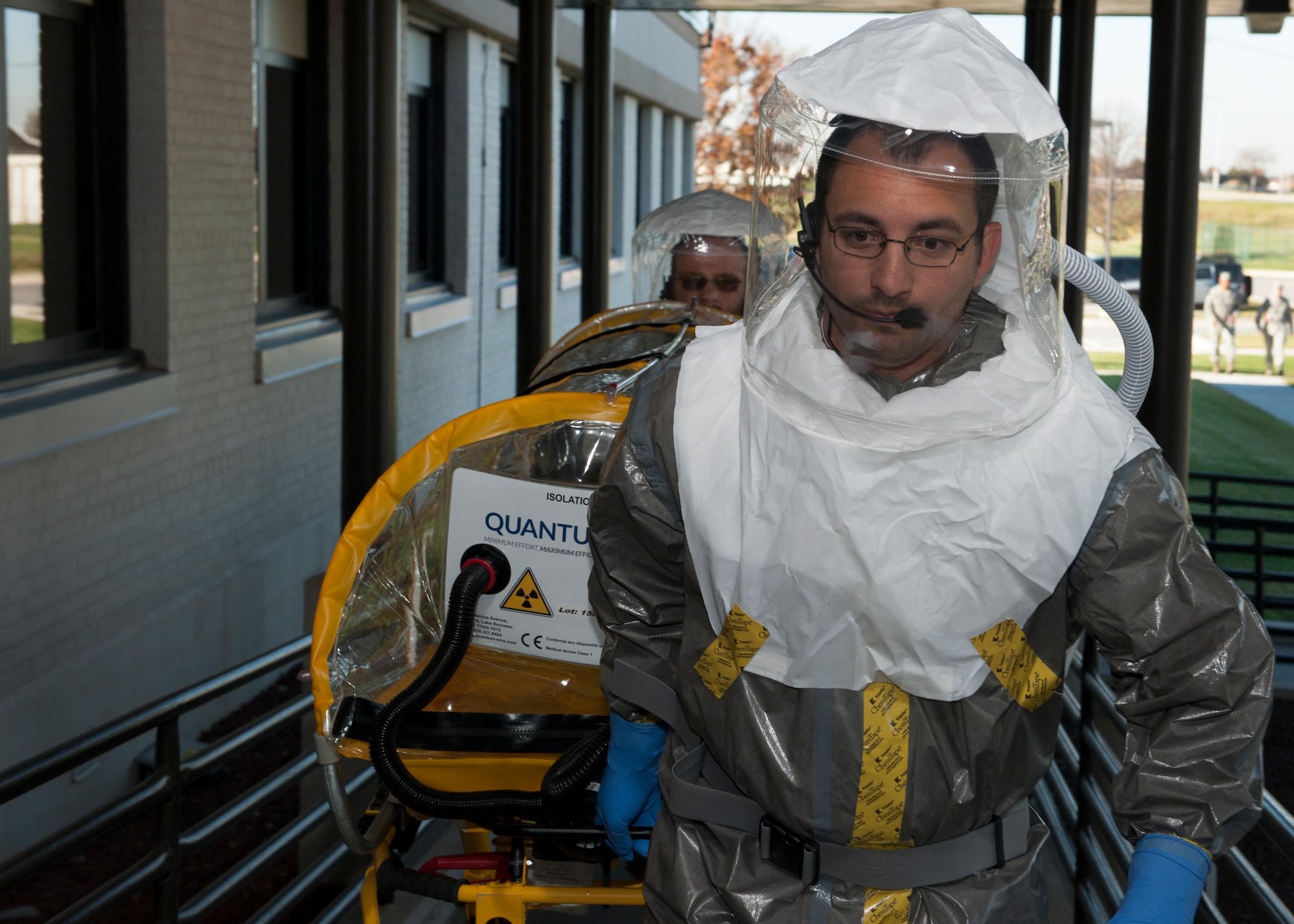 Dave Brown, St. Francis Healthcare emergency medical technician, transports a single patient bio-containment unit (isolation pod) into the 436th Medical Group Clinic Nov. 3, 2015, at Dover Air Force Base, Del. The isolation pod was used to transport a suspected Ebola patient to Christiana Care’s Wilmington Hospital. (U.S. Air Force photo/Senior Airman Zachary Cacicia)