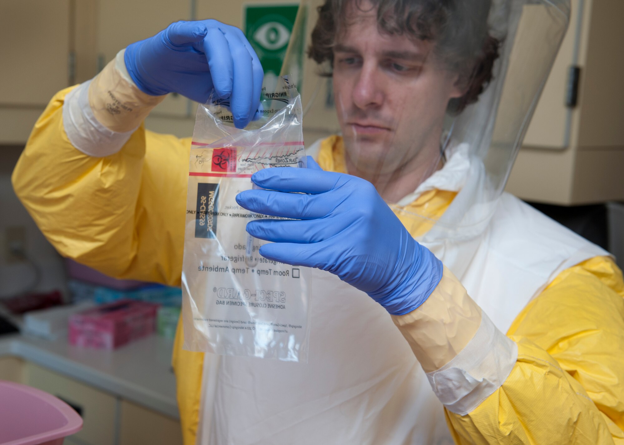 Dan Shultz, Christiana Care registered nurse, places a blood sample vile into a containment bag during an Ebola Response Plan and Transport exercise Nov. 3, 2015, at the Wilmington Hospital in Wilmington, Del. Shultz was one of several medical providers who are trained to use proper personal protective equipment when treating an Ebola patient. (U.S. Air Force photo/Senior Airman Zachary Cacicia)
