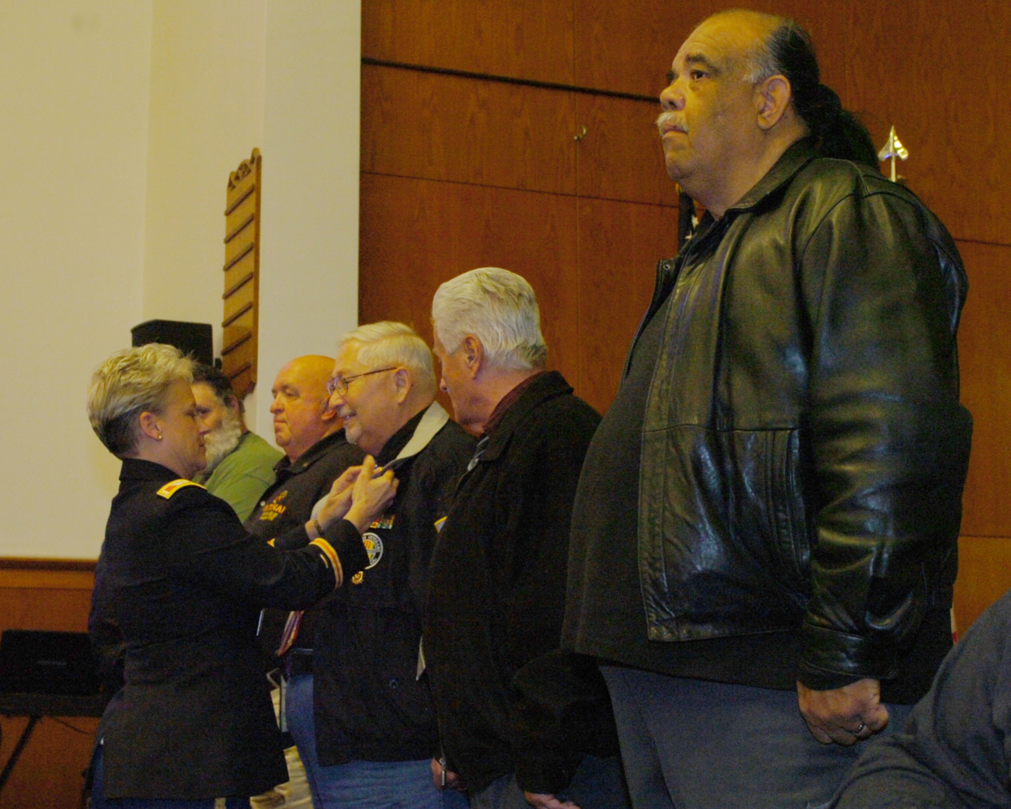 Col. Shelley L. Balderson, Army Support Activity-Fort Dix commander, attaches Vietnam War 50th Anniversary Commemoration pins on Vietnam War-era veterans during the commemoration ceremony here Dec. 1. The pin was presented to all veterans who served from November 1965 to April 30, 1975. (U.S. Army photo by David Moore/Released)