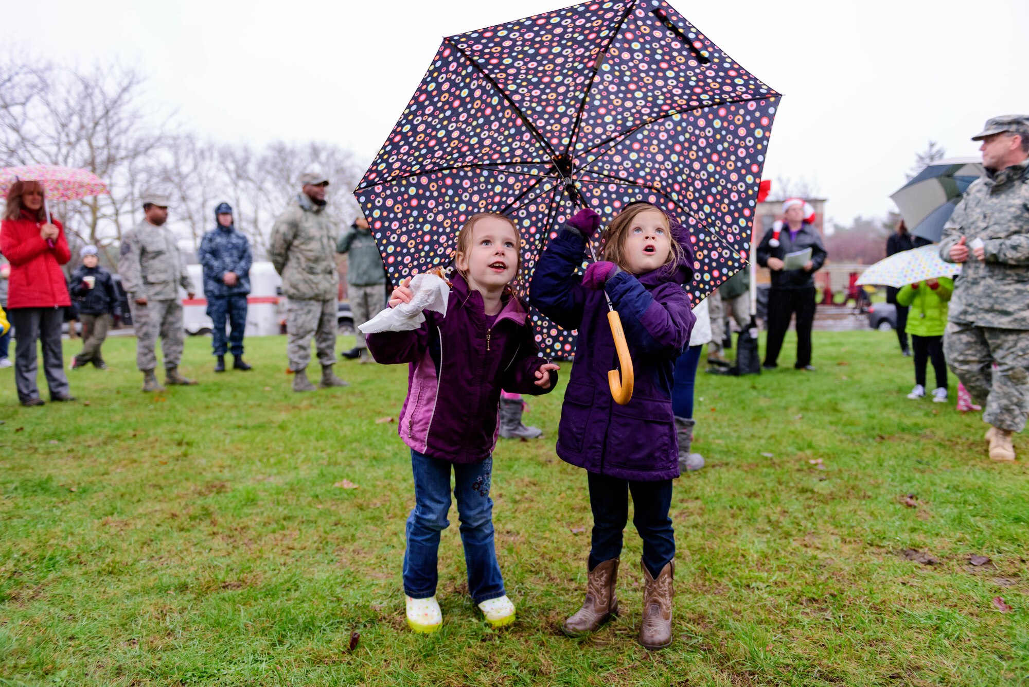 The joint base community gathers for a tree and menorah lighting ceremony outside of Wurman Hall Dec. 2, 2015 at Joint Base McGuire-Dix-Lakehurst, NJ.  Event goers were treated to roasted chestnuts, kettle corn, hot cocoa and hot apple cider; and children had a chance to visit with Santa and Mrs. Claus.  (U.S. Air Force photo by Robert Williard/Released)