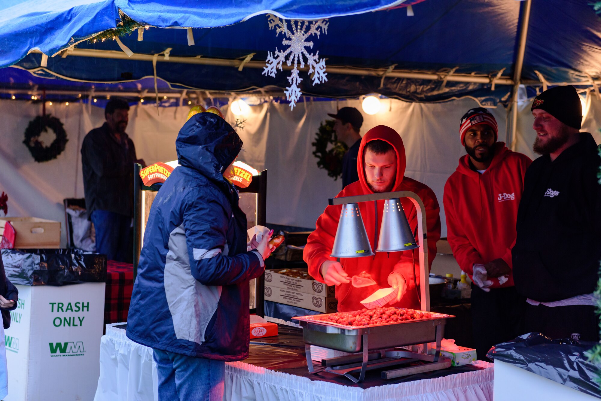 The joint base community gathers for a tree and menorah lighting ceremony outside of Wurman Hall Dec. 2, 2015 at Joint Base McGuire-Dix-Lakehurst, NJ.  Event goers were treated to roasted chestnuts, kettle corn, hot cocoa and hot apple cider; and children had a chance to visit with Santa and Mrs. Claus.  (U.S. Air Force photo by Robert Williard/Released)