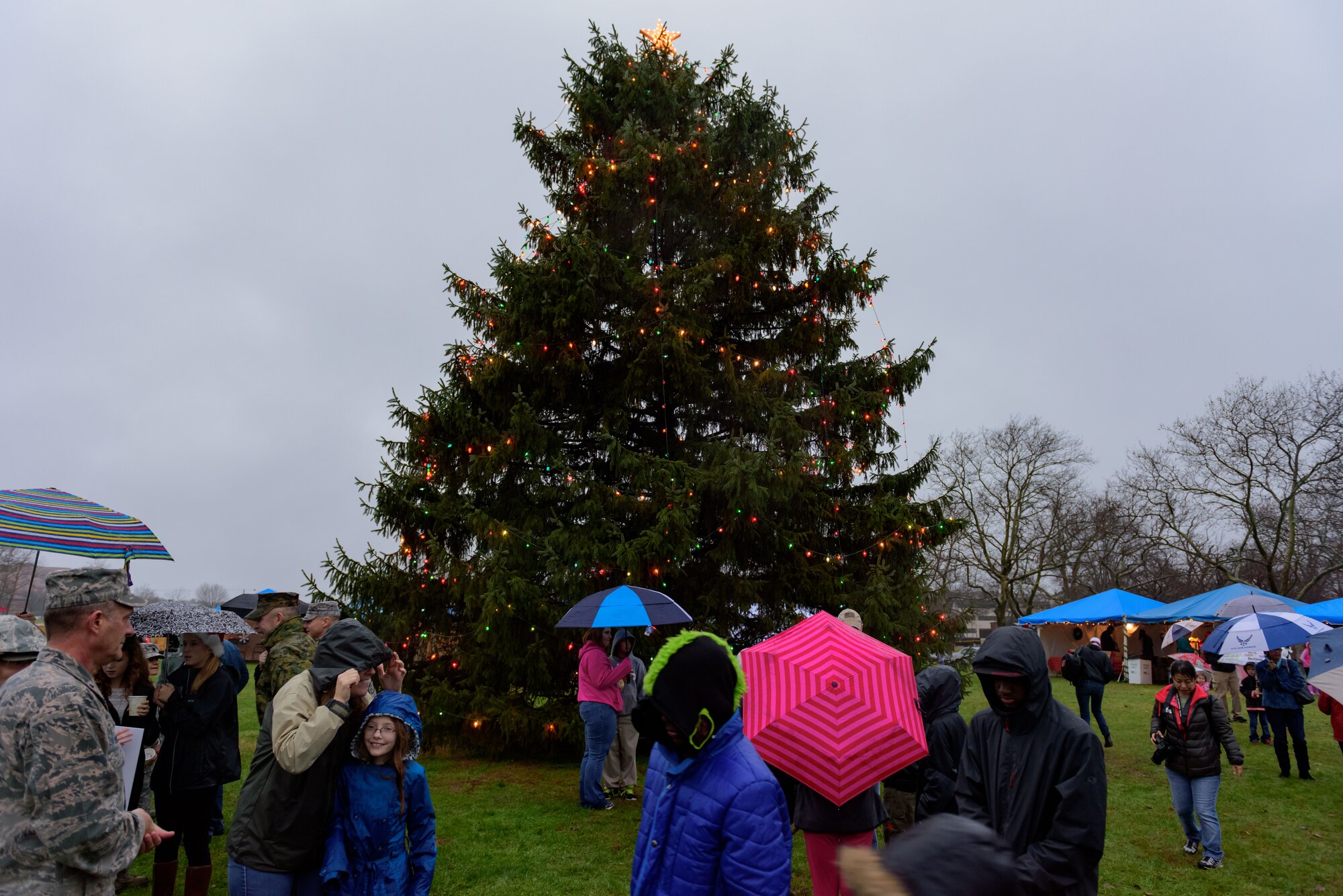 The joint base community gathers for a tree and menorah lighting ceremony outside of Wurman Hall Dec. 2, 2015 at Joint Base McGuire-Dix-Lakehurst, NJ.  Event goers were treated to roasted chestnuts, kettle corn, hot cocoa and hot apple cider; and children had a chance to visit with Santa and Mrs. Claus.  (U.S. Air Force photo by Robert Williard/Released)