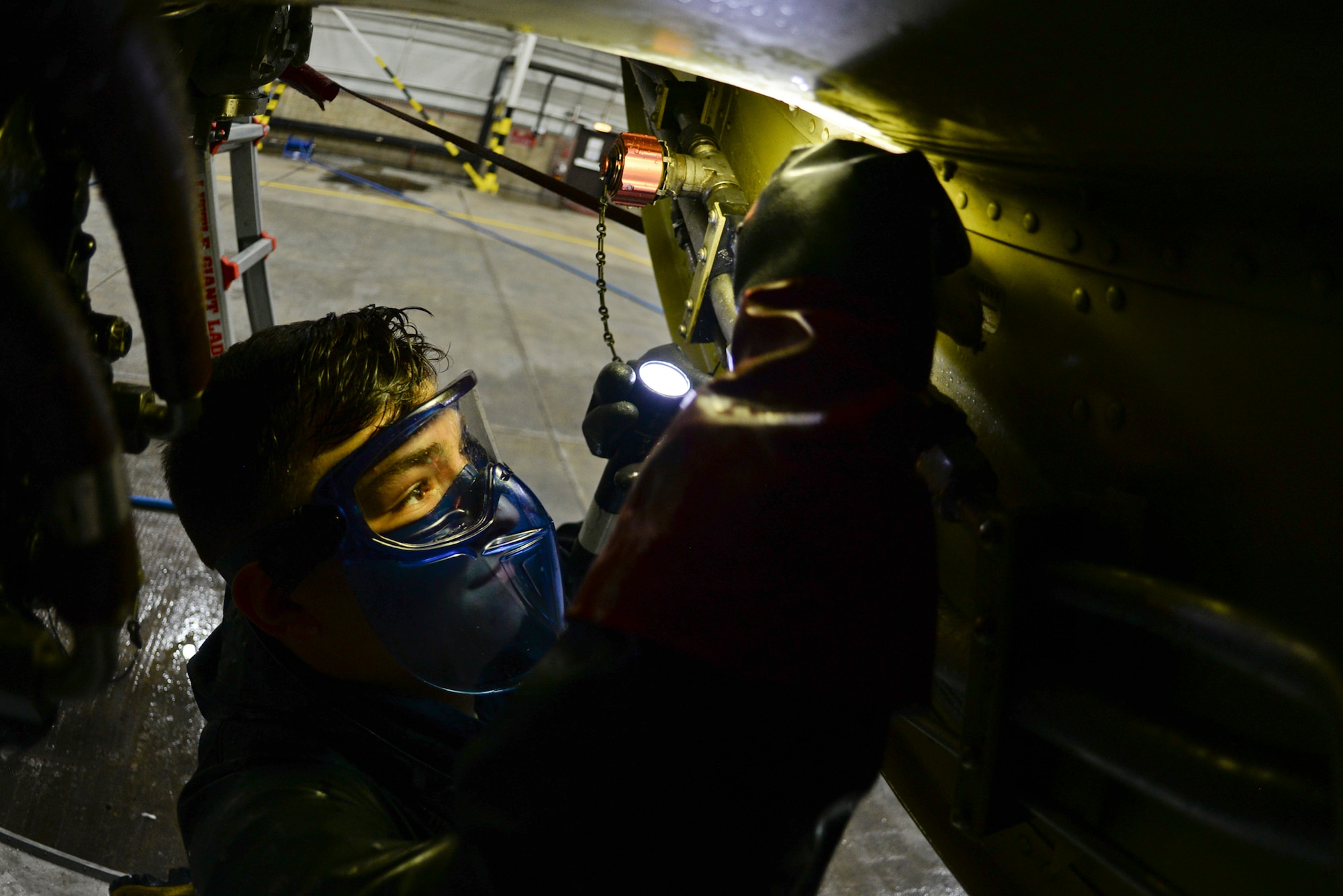 U.S. Air Force Airman 1st Class Jarrod Darnell, 100th Aircraft Maintenance Squadron crew chief, cleans an engine of a KC-135 Stratotanker Nov. 23, 2015, on RAF Mildenhall, England. The wash took six to eight Airmen 10 hours to clean the 136-foot-long aircraft. (U.S. Air Force photo by Staff Sgt. Micaiah Anthony/Released)