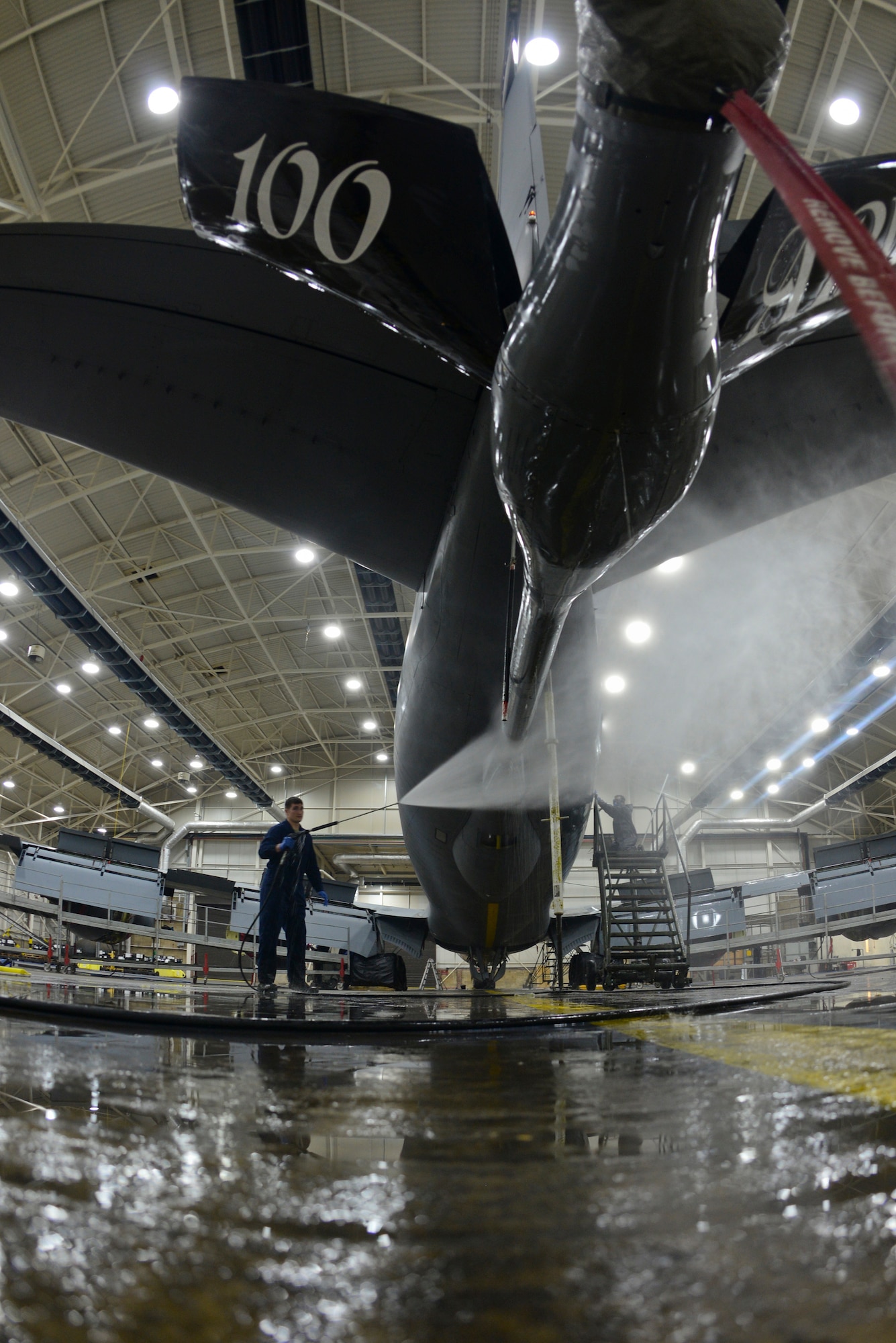 U.S. Air Force Senior Airman Ryan Whitney, 100th Aircraft Maintenance Squadron crew chief, cleans the boom pod of a KC-135 Stratotanker Nov. 23, 2015, on RAF Mildenhall, England. Whitney, along with five other Airmen, washed the aircraft from nose to tail to prevent corrosion. (U.S. Air Force photo by Staff Sgt. Micaiah Anthony/Released)