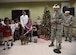 Col. Brad Hoagland, Joint Base Andrews/11th Wing commander, right, speaks to JBA families, as guests prepare to pull the candy cane lever and light up the Christmas tree and Menorah at JBA, Md., Dec. 2, 2015. The Christmas Tree and Menorah Lighting ceremony is an annual event held to kick off the holiday season. (U.S. Air Force photo/ Senior Airman Nesha Humes)