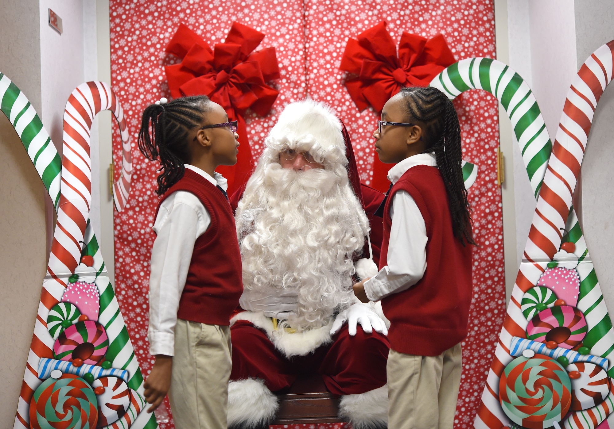 Imagine Andrews choir students talk to Santa Clause during the Christmas tree and Menorah Lighting Ceremony at Joint Base Andrews, Md., Dec. 2, 2015. The annual ceremony featured performances by the U.S. Air Force Band and Imagine Andrews choir. (U.S. Air Force photo/ Senior Airman Nesha Humes)