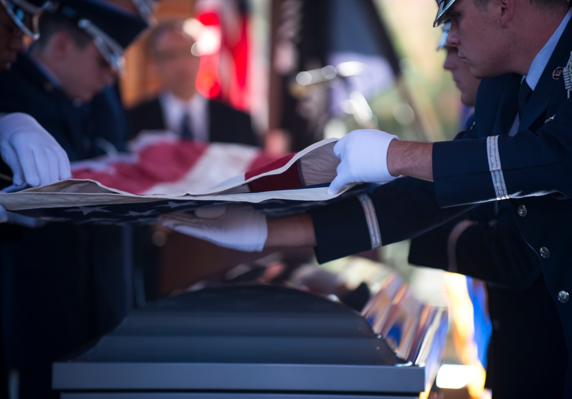Little Rock Air Force Base Honor Guardsmen perform a six-man flag fold during retired U.S. Air Force Col. Michael Denington’s funeral Nov. 19, 2015, at West Tennessee State Veteran's Cemetery. The honor guard performs at many military and civic ceremonies on base along with military funerals around the state of Arkansas. (U.S. Air Force photo by Senior Airman Scott Poe)