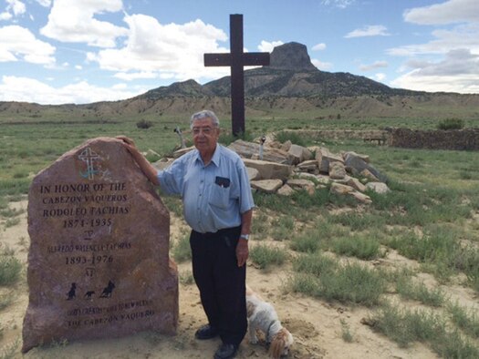Ernesto Tachias, Michael Tachias’ uncle, donated his part of the family ranch for Cabezon Wounded Warrior Haven. Here, Ernesto stands beside a monument to two Tachias ancestors who served in the military and in front of a monument to American military personnel, particularly Michael’s men, who died fighting in Afghanistan. (Courtesy photo)