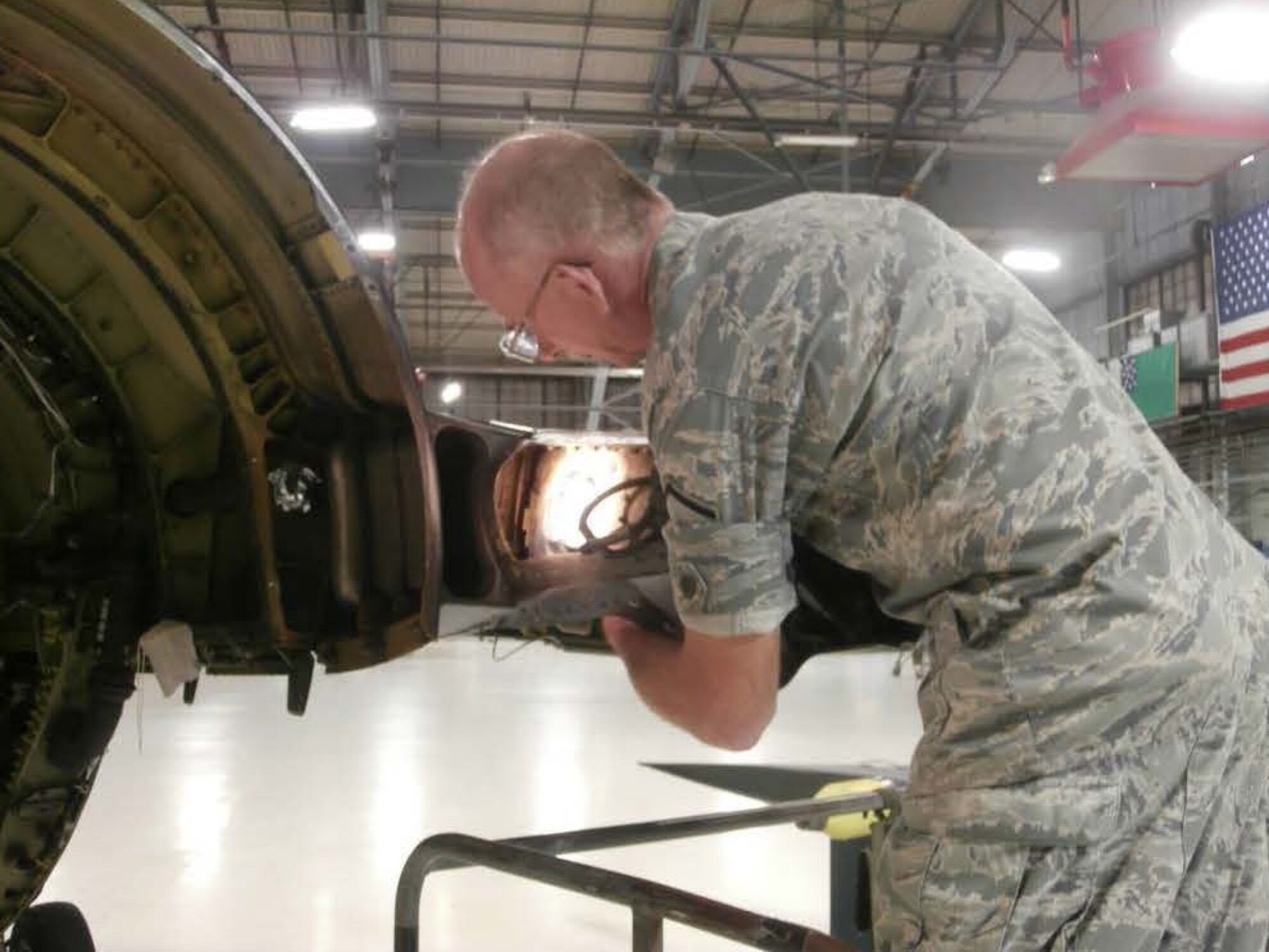 Master Sgt. Richard Miller, a machinist technician at the 158th Fighter Wing, created a reusable tool that allows a single person to fix a structural issue on F-16s that traditionally takes three Airmen two weeks of work to remove and reinstall a major portion of the aft end of the aircraft. Miller's new tool saves the U.S. Air Force more than $33,000 per fix. (Courtesy Photo)