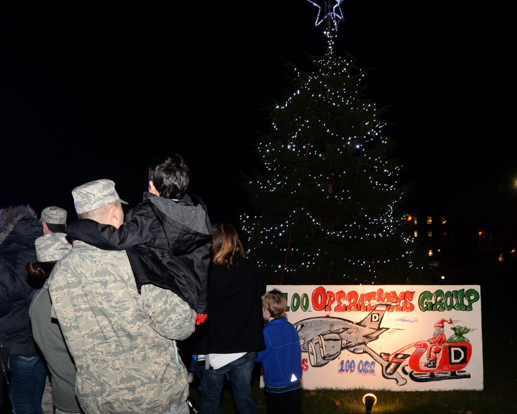 Team Mildenhall Airmen and their families enjoy cookies and hot chocolate at a holiday tree lighting ceremony Dec. 3, 2015, on RAF Mildenhall, England. Soon after the tree lighting, Santa Claus made an appearance to hand out candy. (U.S. Air Force photo by Airman 1st Class Justine Rho/Released)