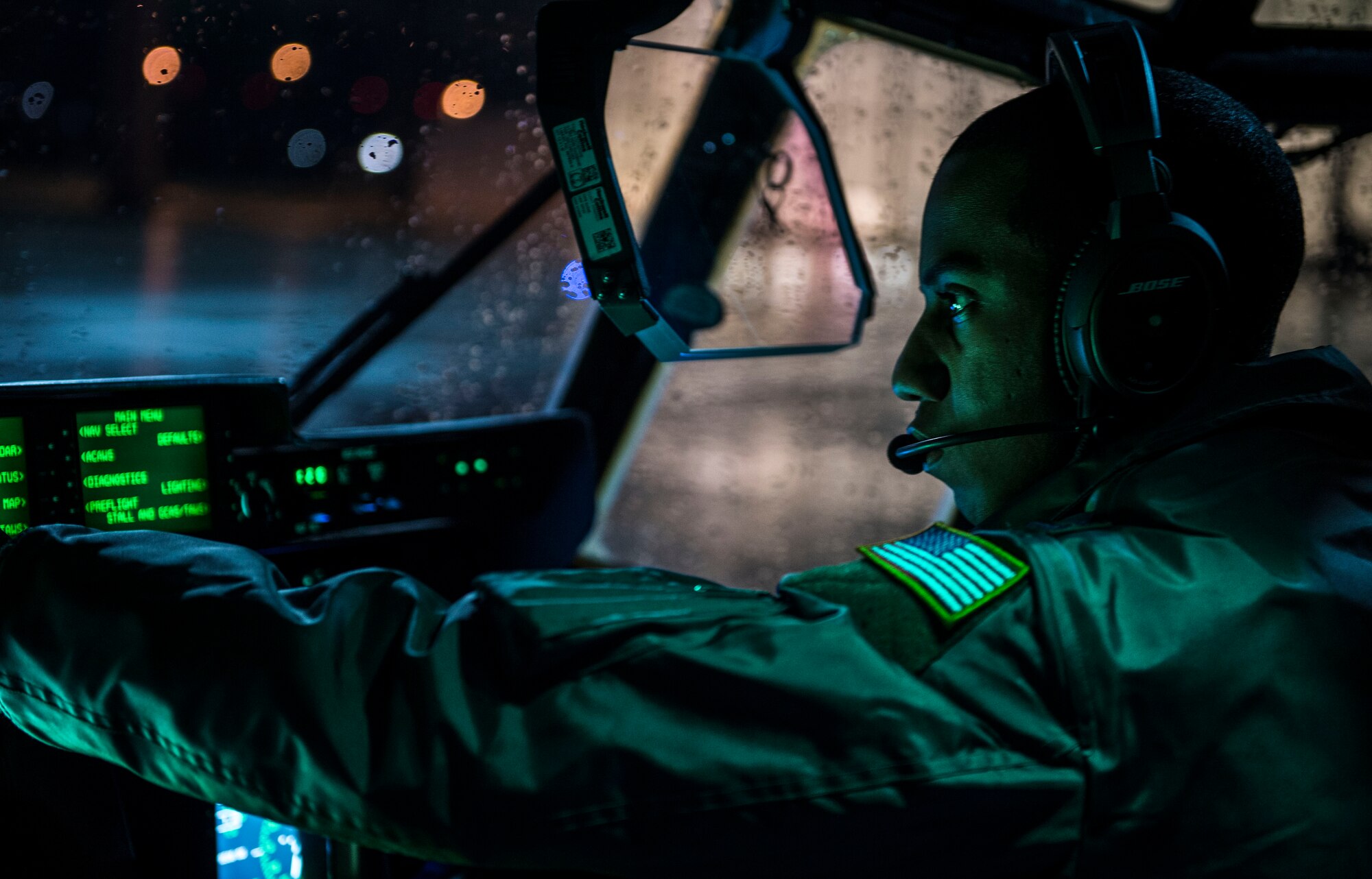 Capt. Chris Scott, 37th Airlift Squadron pilot, prepares for a flight Nov. 25, 2015, at Ramstein Air Base, Germany. Aircrew members spent more than 7 hours to prepare and fly an air drop training mission over U.S. Army Garrison Grafenwoehr, Germany. (U.S. Air Force photo/Staff Sgt. Sara Keller)