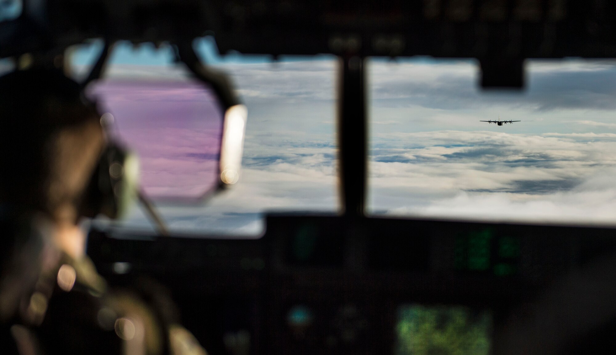 Two C-130J Super Hercules from Ramstein Air Base, Germany, fly toward U.S. Army Garrison Grafenwoehr, Germany, during a training mission Nov. 25, 2015. The 37th Airlift Squadron conducts frequent practice airdrops over the site to maintain capabilities and execute their mission around the globe. (U.S. Air Force photo/Staff Sgt. Sara Keller)