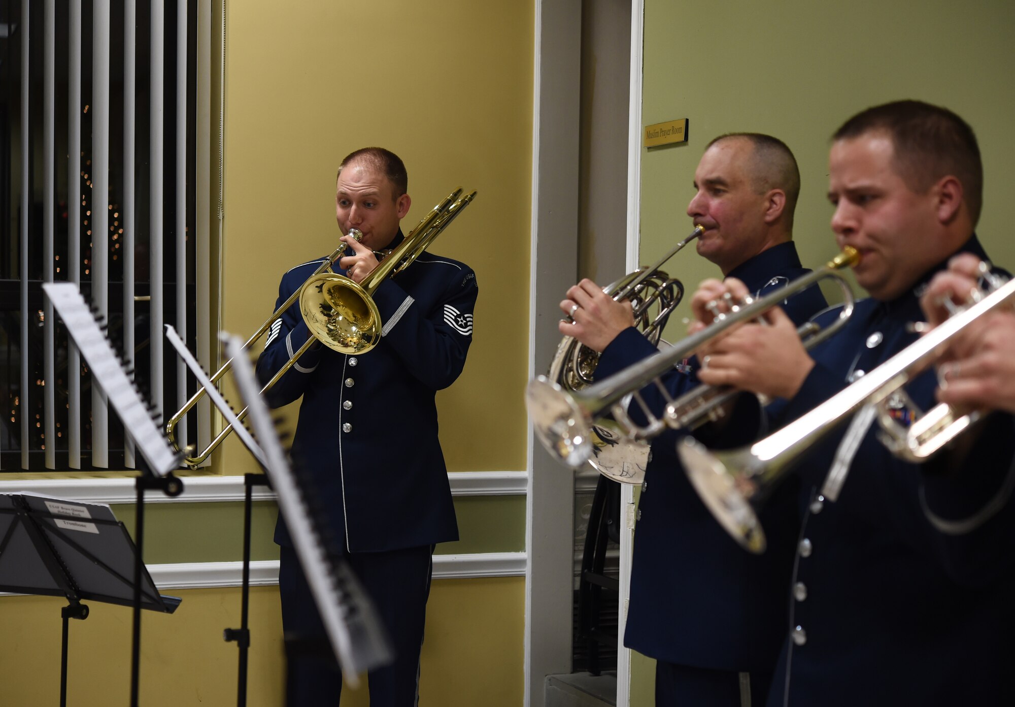 Members of the U.S. Air Force Band perform holiday songs during the Christmas tree and Menorah Lighting Ceremony at Joint Base Andrews, Md., Dec. 2, 2015. The ceremony is an annual event held to kick off the holiday season. (U.S. Air Force photo/ Senior Airman Nesha Humes)