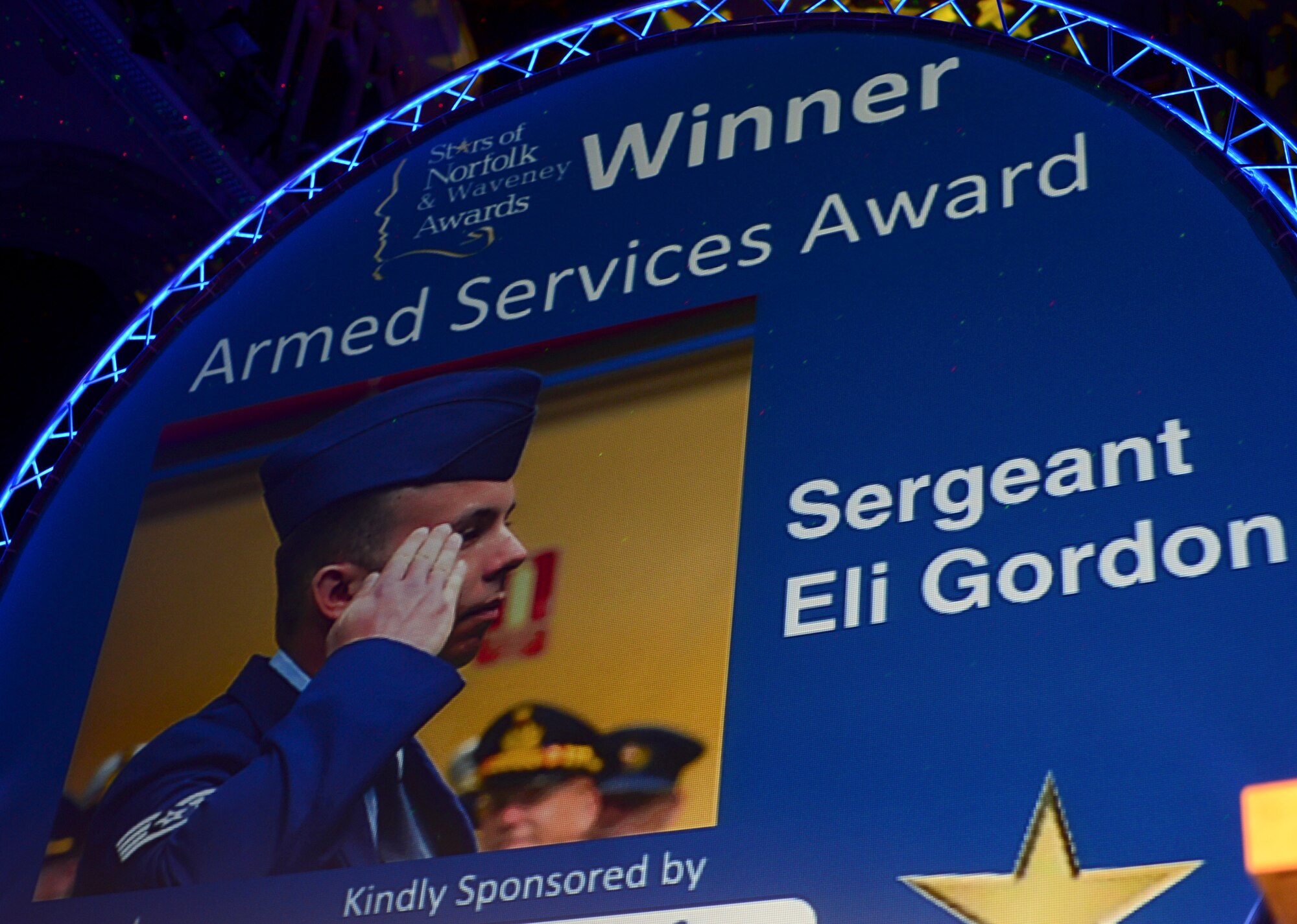 Staff Sgt. Eli Gordon, 492nd Aircraft Maintenance Unit activity security manager, is named the Armed Services Person of the Year award winner during the Stars of Norfolk and Waveney Awards ceremony at St. Andrews Hall, Norfolk, England, Dec. 3, 2015. Gordon was recognized for his heroic actions after a Hellenic air force F-16 crashed during Tactical Leadership Program 15-1 in Spain. (U.S. Air Force photo by Senior Airman Erin Trower) 