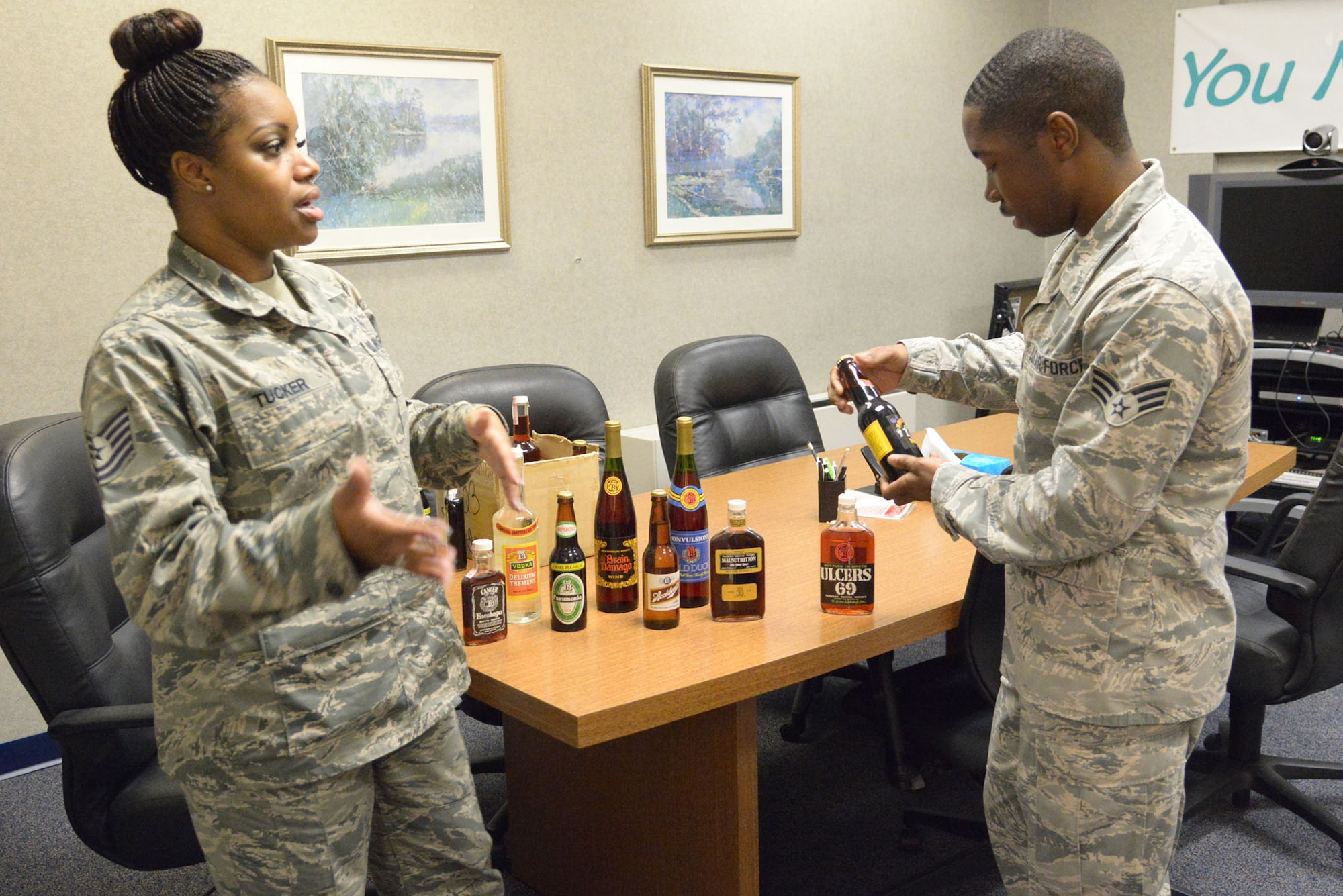 Tech. Sgt. La’ Kisha Tucker, Robins ADAPT program noncommissioned officer in charge, and Senior Airman Mourice McDuffie, Mental Health technician, set up props used for education and prevention counseling. The Air Force recognizes alcoholism as a preventable, progressive, treatable and non-compensable disease that affects the entire family. The ADAPT Clinic provides prevention, substance abuse education, assessments and rehabilitation. (U.S. Air Force photo by Ray Crayton)