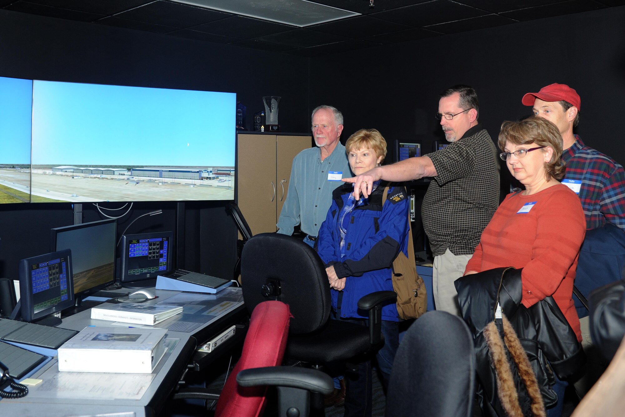 A group of landowners from the surrounding area get an inside look at the air traffic control simulator Dec. 3, 2015, at McConnell Air Force Base, Kan. The tour was part of the Landowner’s Appreciation Dinner in which local landowners were welcomed to base to learn more about McConnell, its Airmen and the Landowner Program. (U.S. Air Force photo/Senior Airman Tara Fadenrecht)