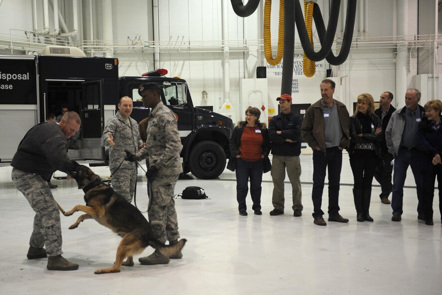 Members of the 22nd Security Forces Squadron perform a demonstration for local landowners Dec. 3, 2015, at McConnell Air Force Base, Kan. The demonstration was part of a tour in which local landowners learned about the landowner program and the importance of keeping wildlife out of the path of aircraft. (U.S. Air Force photo/Senior Airman Tara Fadenrecht)