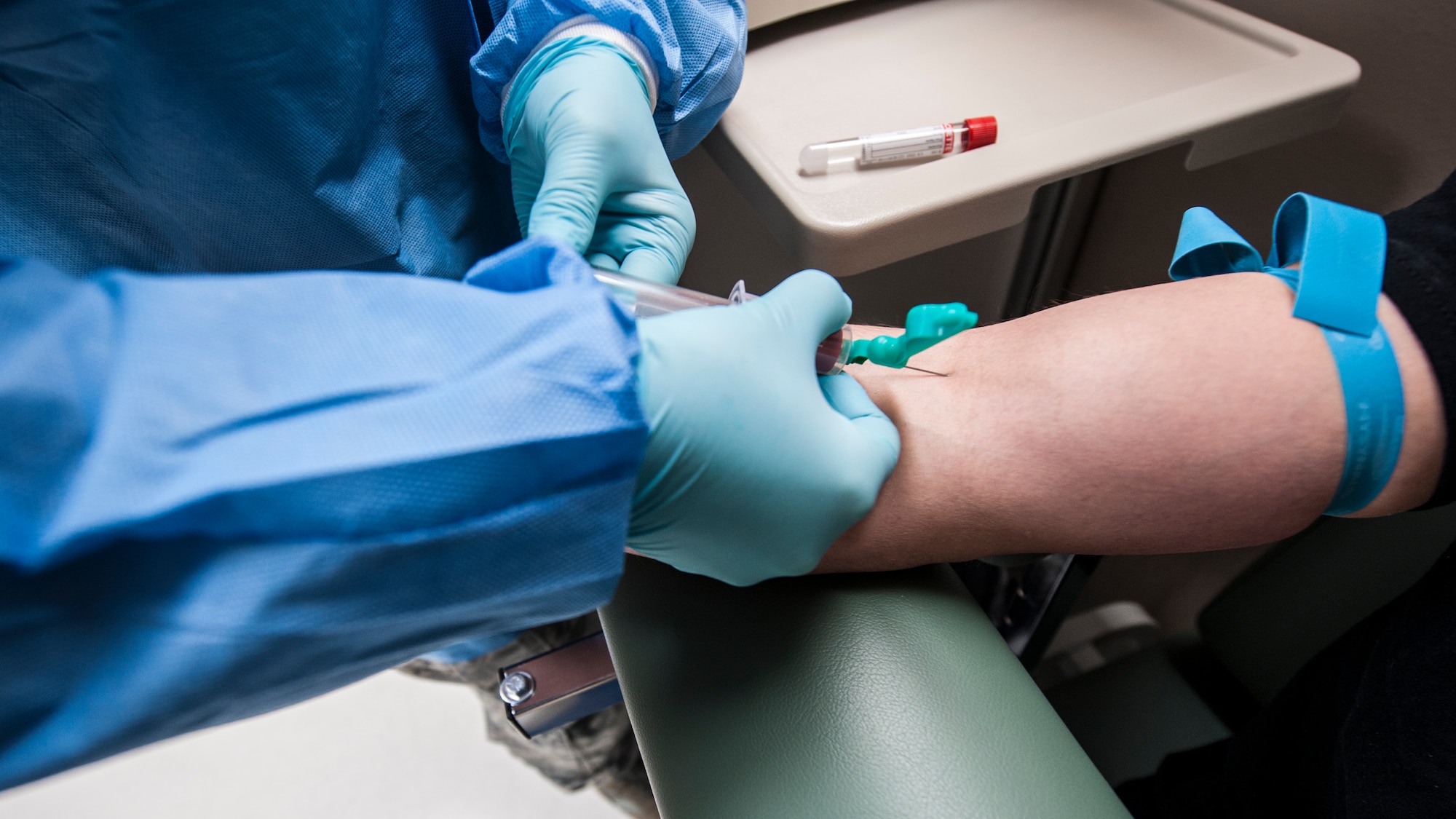 Tech. Sgt Carolyn Tisdale, 92nd Medical Support Squadron noncommissioned officer in charge of the laboratory, draws blood from Airman 1st Class Ryan Dowdy, 92nd Aircraft Maintenance Squadron crew chief, Dec. 1, 2015, Fairchild Air Force Base, Wash. The Lab provides doctors and other providers with lab test results ranging from analyzing blood, urine or stool samples. (U.S. Air Force photo/Airman 1st Class Sean Campbell)