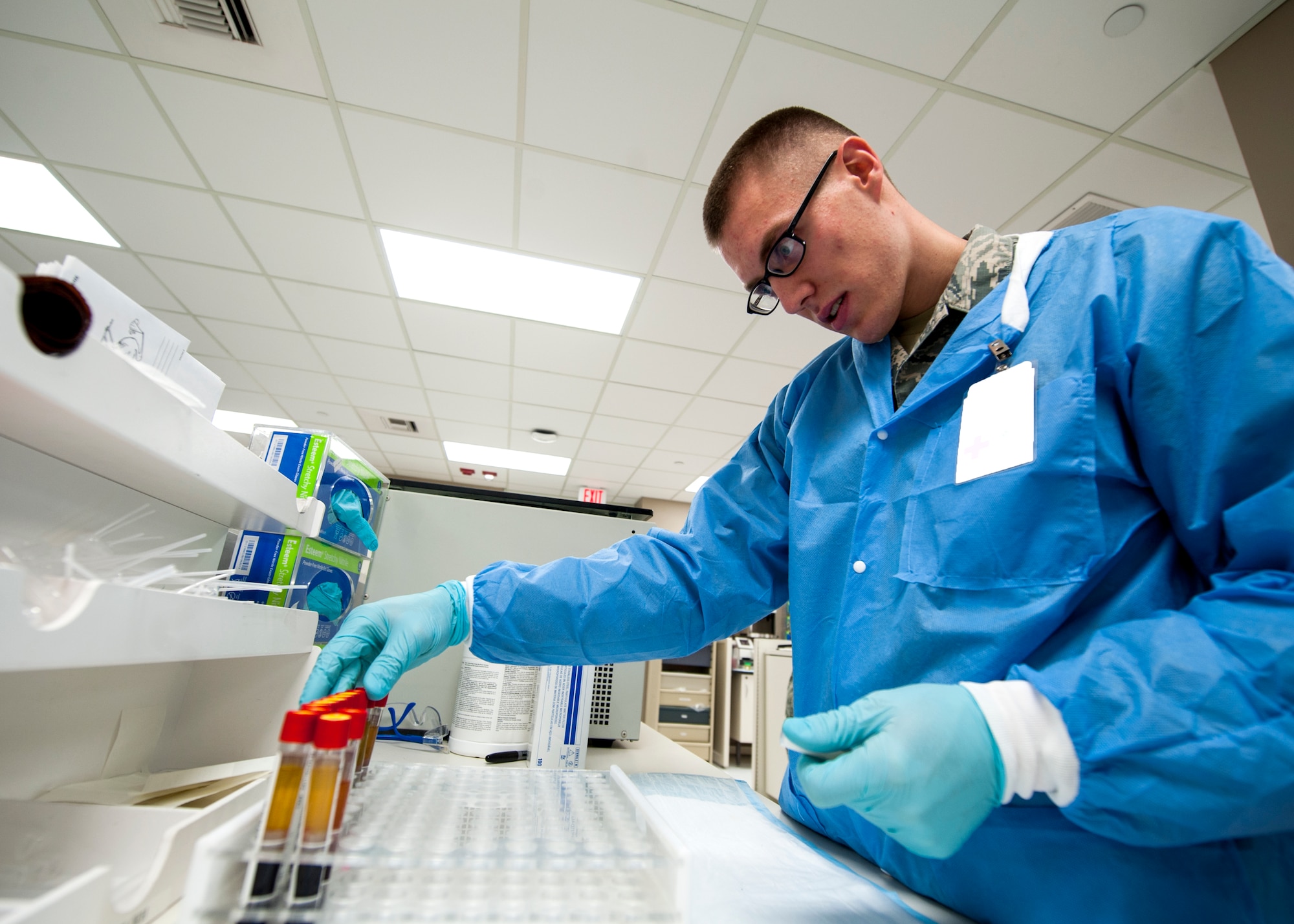 Senior Airman David Gehring, 92nd Medical Support Squadron medical laboratory technician, conducts lab work Dec. 1, 2015, Fairchild Air Force Base, Wash. Quality control serum has pre-determined results in order to determine the result range of the analyzer being used. (U.S. Air Force illustration/Airman 1st Class Sean Campbell)