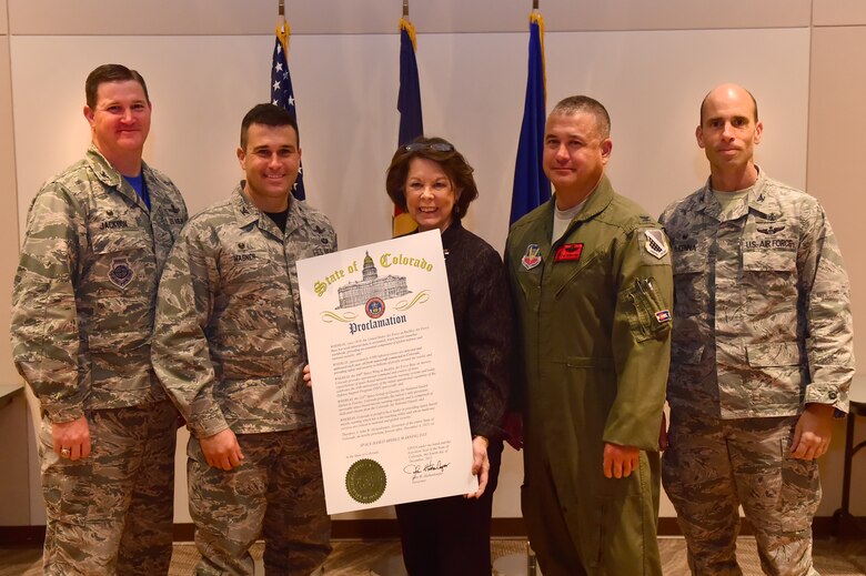 (From left) Col. Michael Jackson, 460th Space Wing Operations Group commander, Col. John Wagner, 460th Space Wing commander, Su Ryden, State Representative District 36, Col. Floyd Dunstan, 140th Wing commander and Col. Thomas Mckenna, 233rd Space Group commander, stand together with the proclamation stating Dec. 4 as Space-based Missile Warning Day Dec. 4, 2015, at the Leadership Development Center on Buckley Air Force Base, Colo. John W. Hickenlooper, Colorado governor, proclaimed that Dec. 4 will now and forever be Space-based Missile Warning Day in the State of Colorado. (U.S. Air Force photo by Airman 1st Class Luke W. Nowakowski/Released)