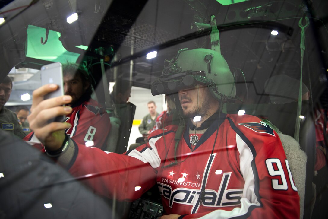 Marcus Johansson, Washington Capitals center, takes a selfie inside a UH-1N helicopter from the 1st Helicopter Squadron during the team’s visit to Joint Base Andrews, Md., Dec. 1, 2015. The squadron is responsible for priority airlift for National-level civilian and senior military leadership throughout the National Capital Region. (U.S. Air Force photo/Airman 1st Class Philip Bryant/released) 