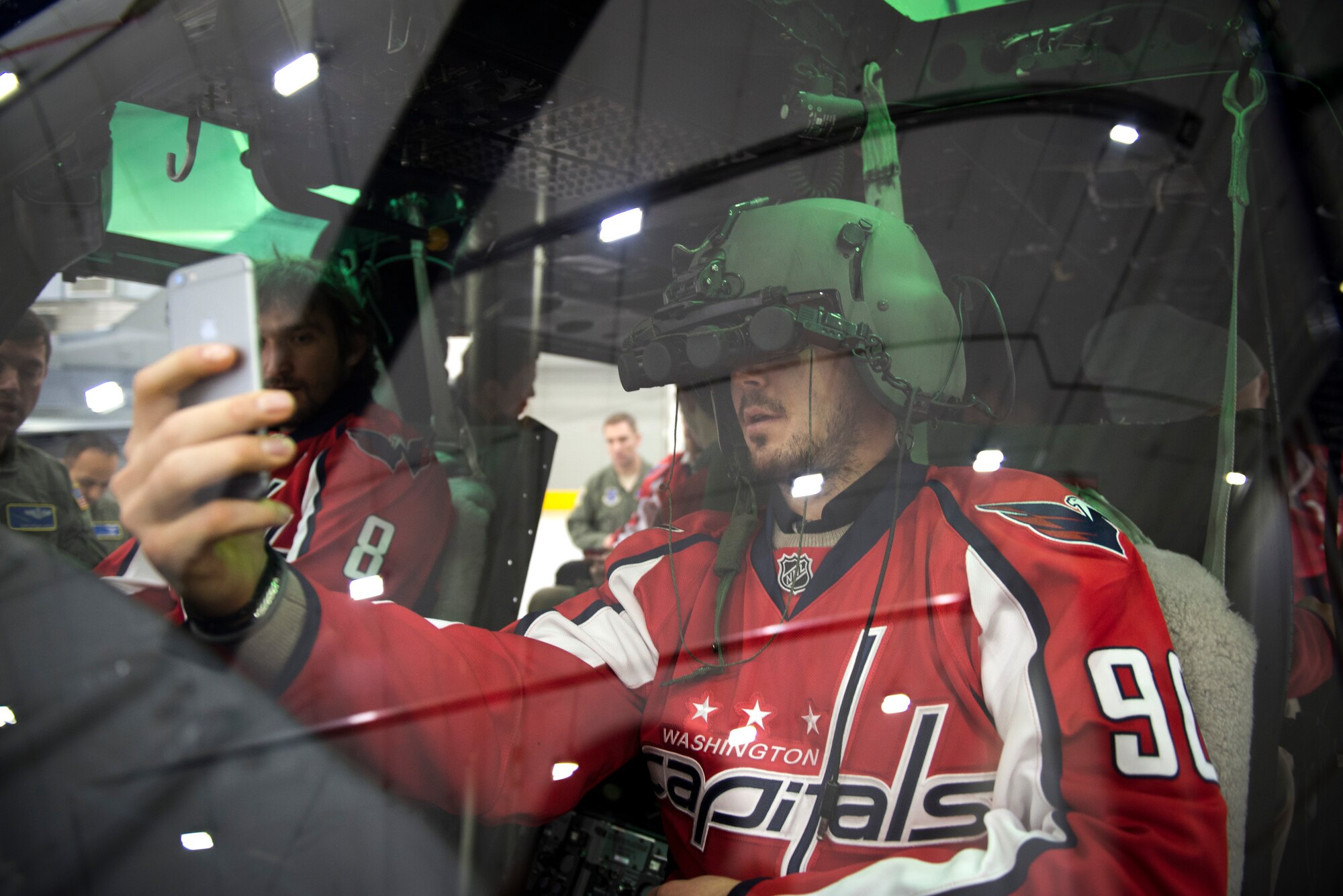 Marcus Johansson, Washington Capitals center, takes a selfie inside a UH-1N helicopter from the 1st Helicopter Squadron during the team’s visit to Joint Base Andrews, Md., Dec. 1, 2015. The squadron is responsible for priority airlift for National-level civilian and senior military leadership throughout the National Capital Region. (U.S. Air Force photo/Airman 1st Class Philip Bryant/released) 