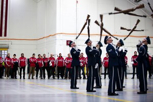 U.S. Air Force Honor Guard Drill Team members perform for Washington Capitals players during their visit to Joint Base Andrews, Md., Dec. 1, 2015. The Drill Team is the traveling component of the U.S. Air Force Honor Guard whose mission is to promote the Air Force by showcasing drill performances to recruit, retain, and inspire Airmen. (U.S. Air Force photo/Airman 1st Class Philip Bryant/released)