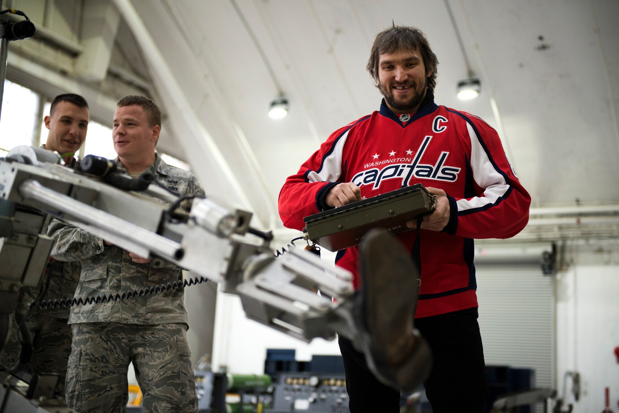 Alexander Ovechkin, Washington Capitals left wing, controls an ANDROS F6A explosive ordinance disposal robot during the team’s visit to Joint Base Andrews, Md., Dec. 1, 2015. During the demonstration, Capitals members got hands-on experience performing tasks EOD members are responsible for every day. (U.S. Air Force photo/Airman 1st Class Philip Bryant/released)