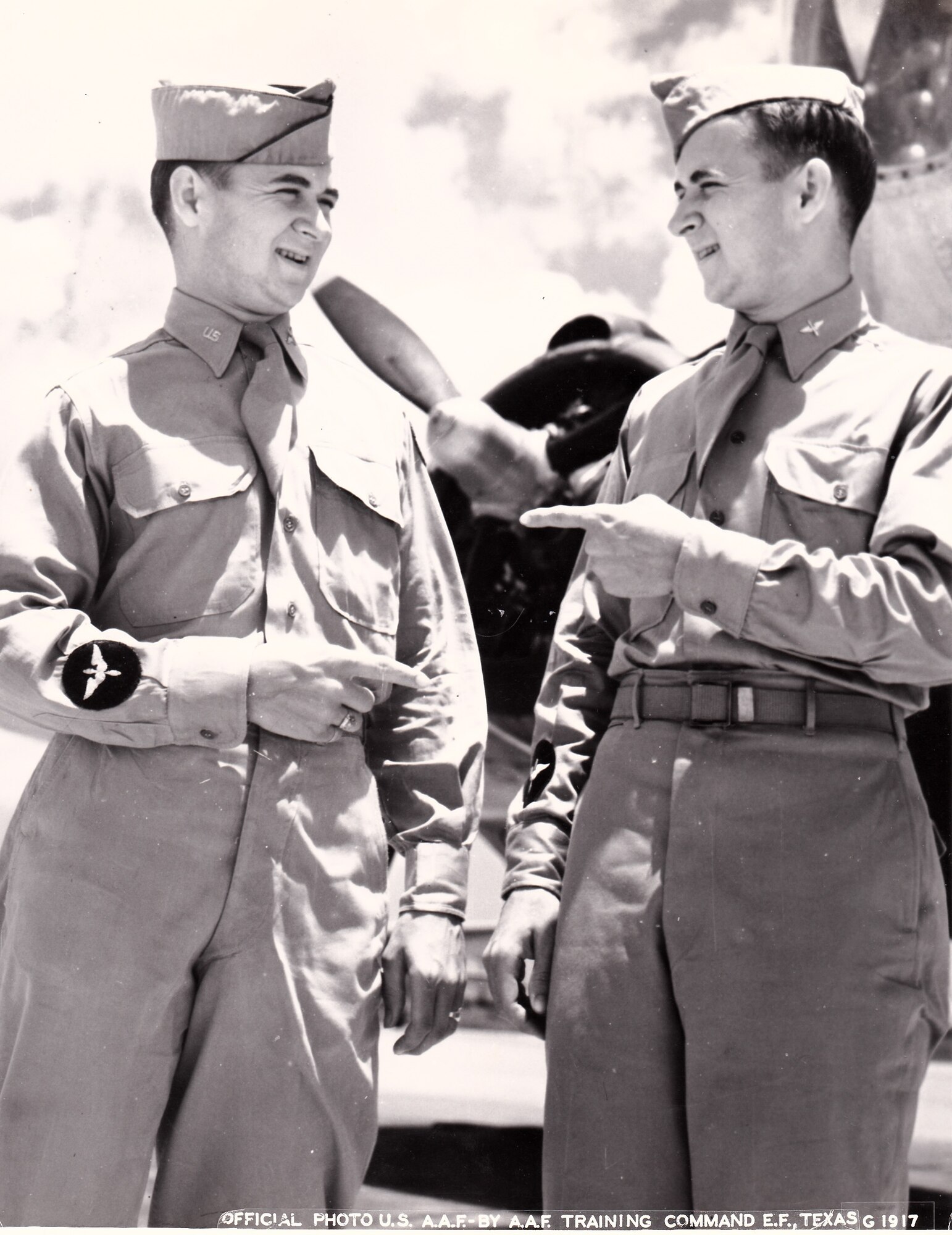 A vintage photo of retired Air Force Reserve Majs. Raymond “Glenn” Clanin and Russell “Lynn” Clanin during training in the Aviation Cadet program, prior to receiving their pilot's wings in August 1944 at Ellington Field, Texas. Seventy-one years later, the 92-year-old twin brothers are recipients of the French government's highest distinction for their military service as World War II veterans, the Legion of Honor medal, presented by Christophe Lemoine, French consul general in Los Angeles, during a ceremony held at Los Angeles Air Force base in El Segundo, Calif. (Courtesy photo, U.S. Army Air Forces, AAF Training Command, Ellington Field, Texas)
