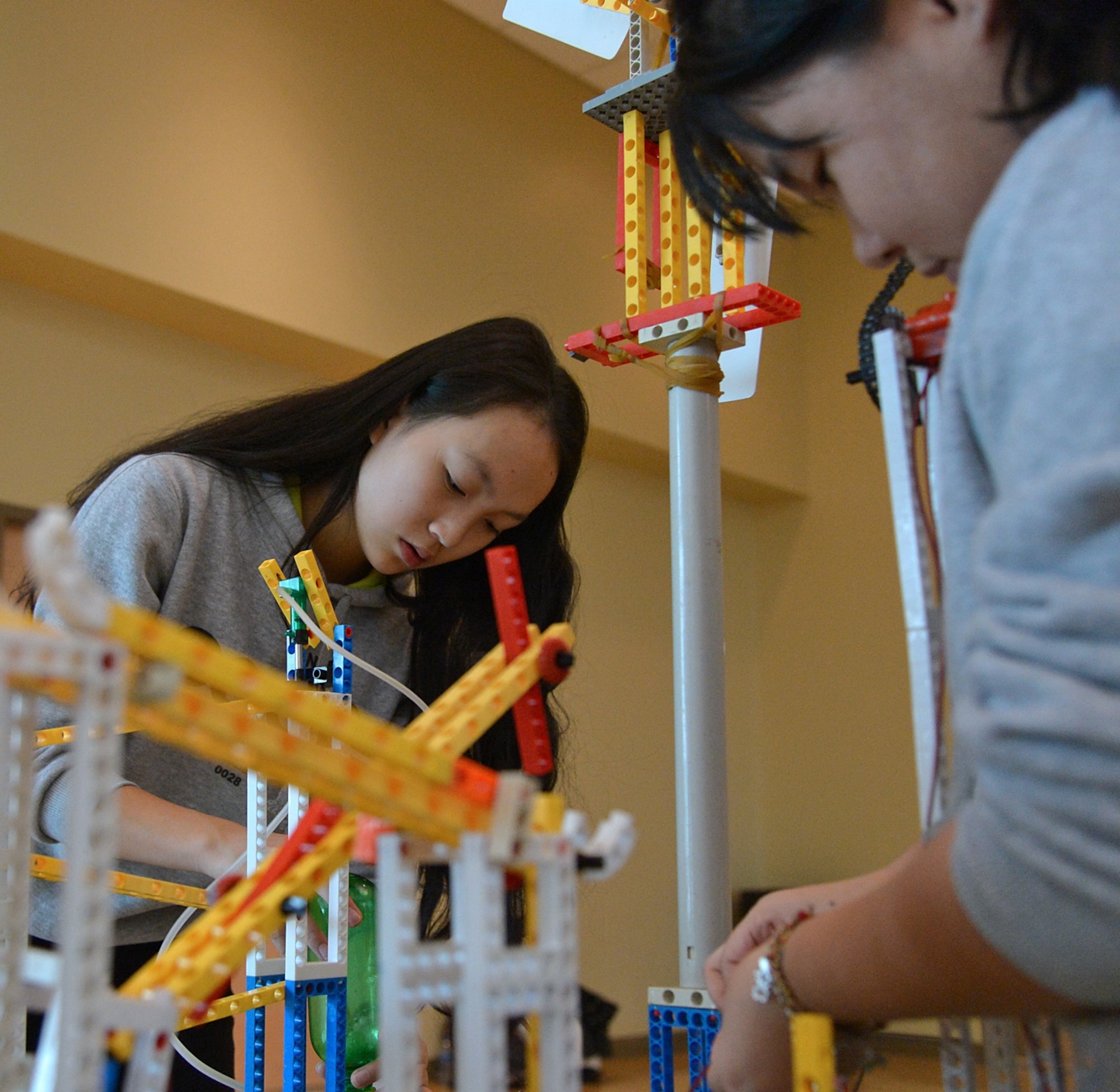 “Dreamer” team members from Cheng du High-Tech, Xinyuan, China, prepare their Rube Goldberg Machine for competition Dec. 4 at Weber State University, Ogden, Utah. Hill Air Force Base and the Air Force Association, Northern Utah chapter, hosted the STEM event, which provided an educational opportunity for local and international high-school and middle-school students. (U.S. Air Force photo by Alex R. Lloyd)