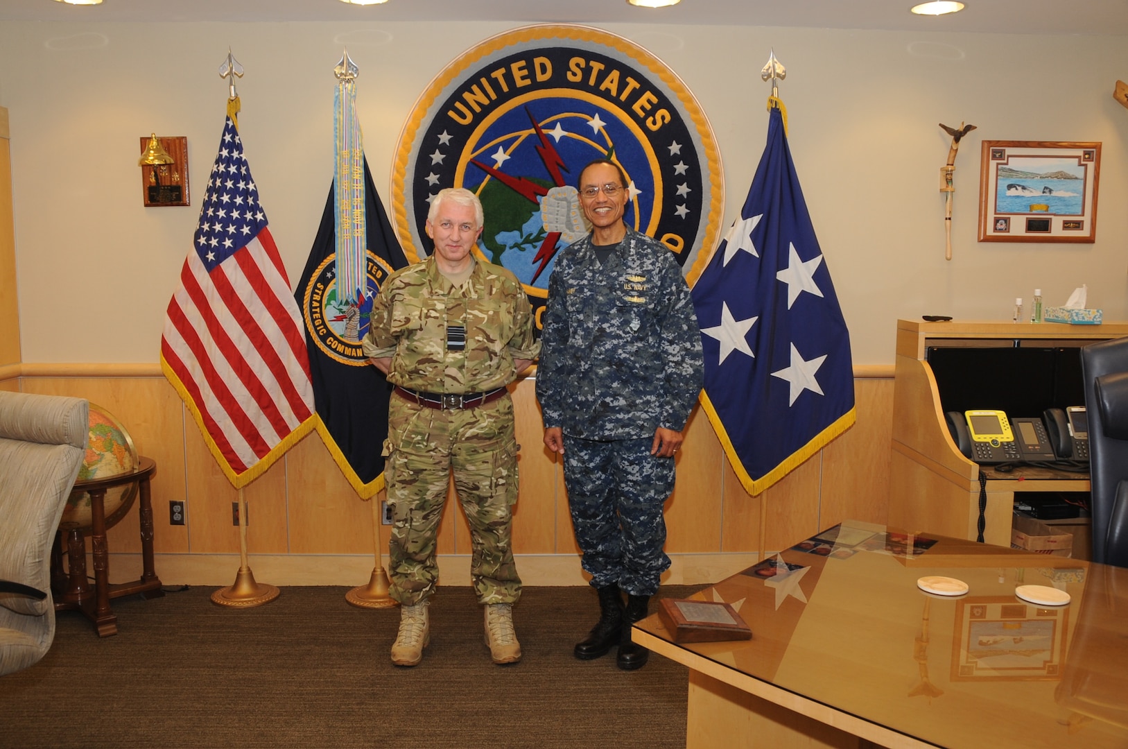 U.S. Navy Adm. Cecil D. Haney (right), U.S. Strategic Command commander, poses for a photo with U.K. Royal Air Force Air Marshal Phil C. Osborn, U.K. Chief of Defence Intelligence, during Osbornâ€™s visit to USSTRATCOM Headquarters, Offutt Air Force Base, Neb., Dec. 3, 2015. While here, Osborn participated in a series of discussions with USSTRATCOM senior leaders to gain a better understanding of the command and its missions. Hosting Osborn's visit is one of many of USSTRATCOM's ongoing efforts to build and maintain enduring relationships with partner nations to confront the broad range of global challenges. One of nine DoD unified combatant commands, USSTRATCOM has global strategic missions, assigned through the Unified Command Plan, which include strategic deterrence; space operations; cyberspace operations; joint electronic warfare; missile defense; intelligence, surveillance and reconnaissance; combating weapons of mass destruction; and analysis and targeting. (USSTRATCOM photo by Steve Cunningham)
