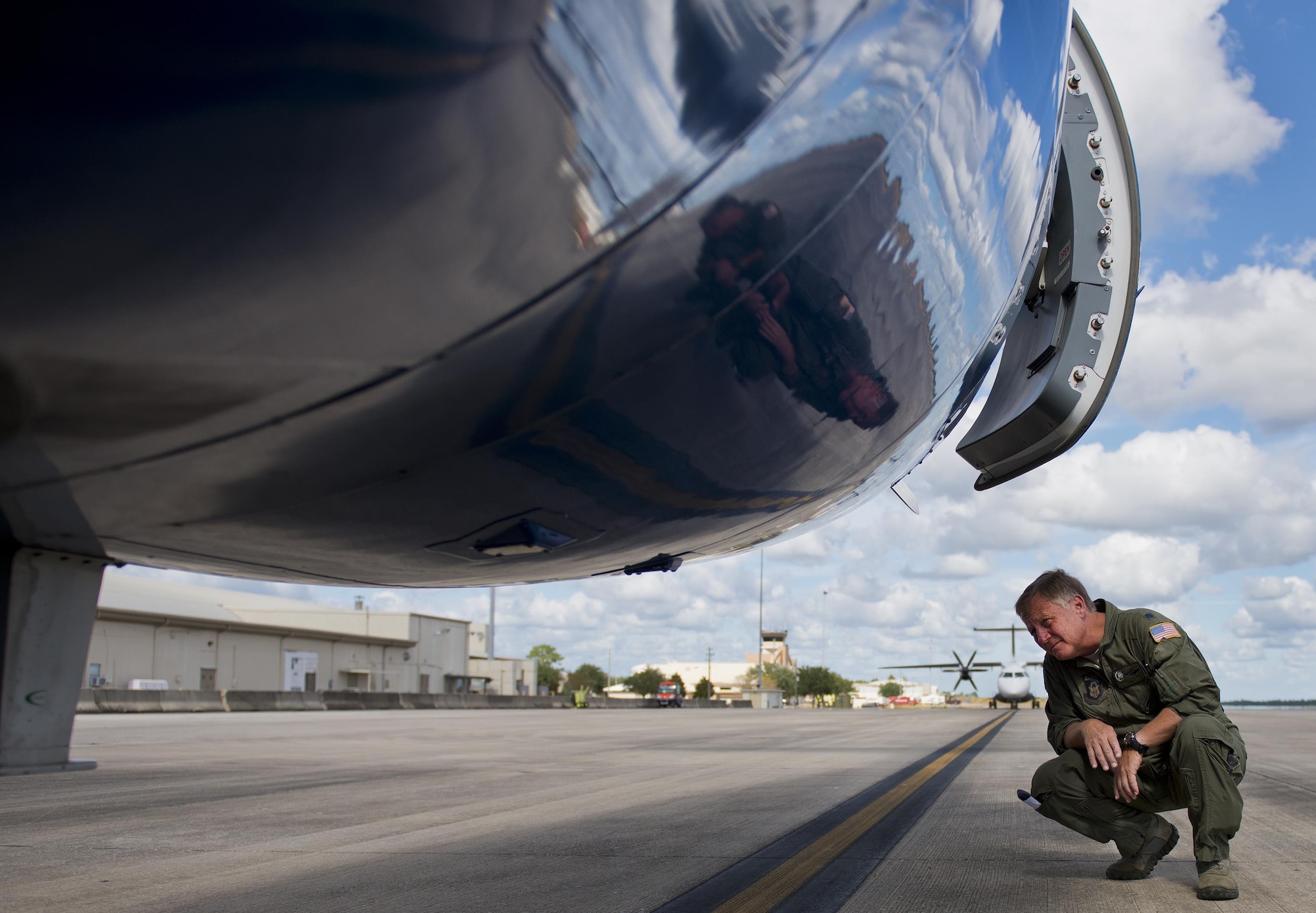 Lt. Col. Michael Theriot, 711th Special Operations Squadron, completes his postflight checks on a C-146 Wolfhound at Duke Field, Fla., Oct. 21.  The Air Force Special Operations Wing aircraft are used specifically in the training and operation of the 919th Special Operations Wing’s nonstandard aviation mission.  (U.S. Air Force photo/Tech. Sgt. Sam King)