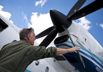Lt. Col. Michael Theriot, 711th Special Operations Squadron, completes his postflight checks on a C-146 Wolfhound at Duke Field, Fla., Oct. 21.  The Air Force Special Operations Wing aircraft are used specifically in the training and operation of the 919th Special Operations Wing’s nonstandard aviation mission.  (U.S. Air Force photo/Tech. Sgt. Sam King)