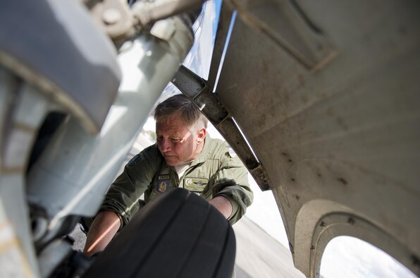 Lt. Col. Michael Theriot, 711th Special Operations Squadron, completes his postflight checks on a C-146 Wolfhound at Duke Field, Fla., Oct. 21.  The Air Force Special Operations Wing aircraft are used specifically in the training and operation of the 919th Special Operations Wing’s nonstandard aviation mission.  (U.S. Air Force photo/Tech. Sgt. Sam King)