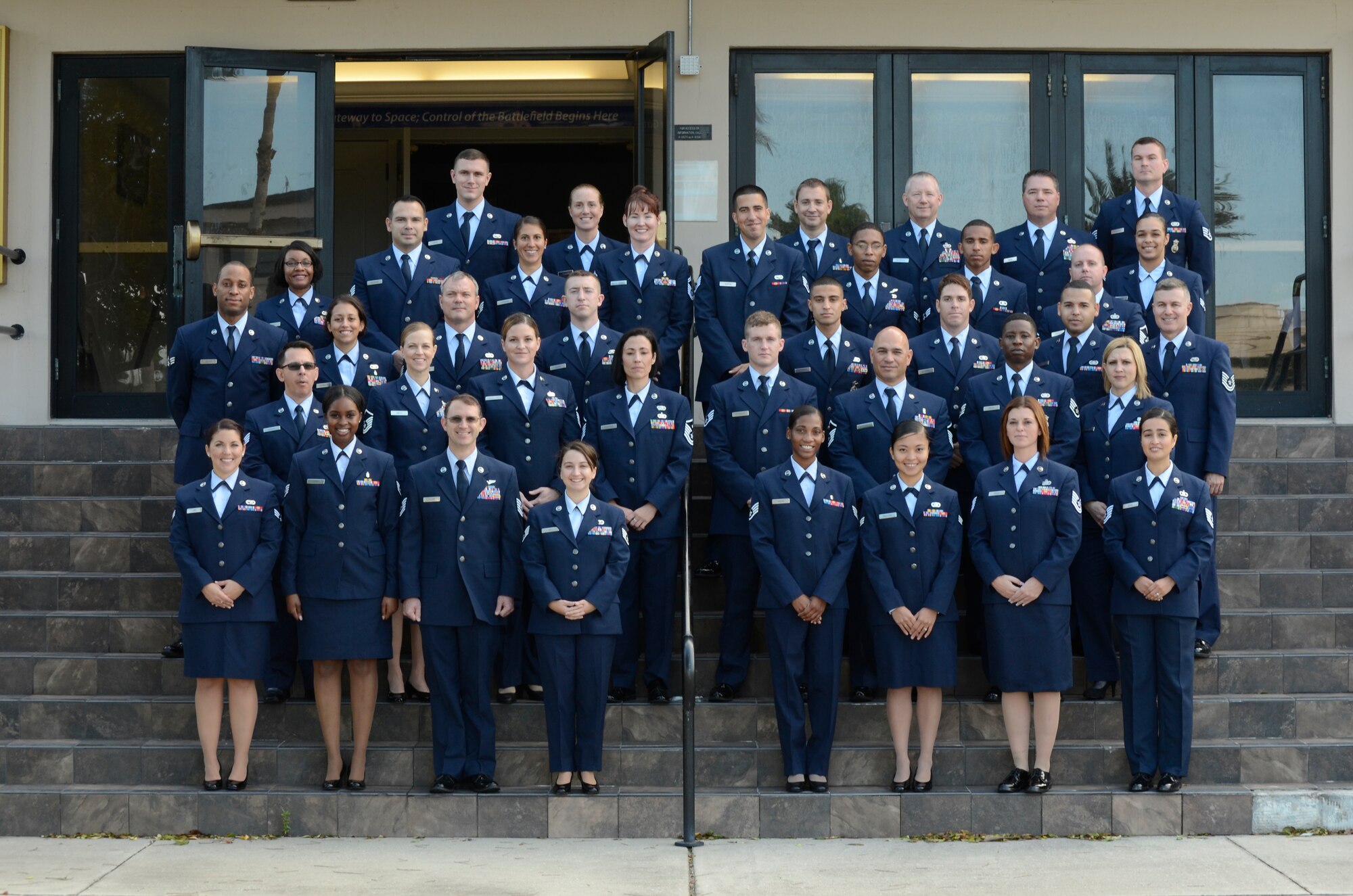 Forty three Reserve Airmen from the 920th Rescue Wing here graduated with an associate’s degree from the Community College of the Air Force December 5 in a two-hour ceremony held in the Patrick Air Base Theater. (U.S. Air Force photo/Tech. Sgt. Mike Means)

