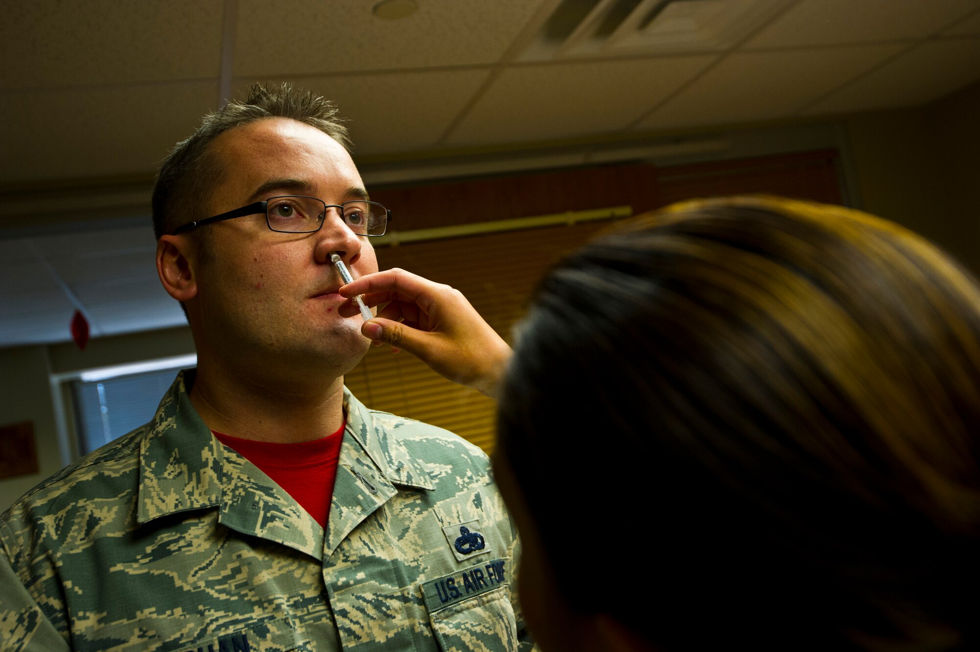 NELLIS AIR FORCE BASE, Nev. -- Senior Master Sgt. Brendan Vaughan, 926th Aircraft Maintenance Squadron Superintendent, receives a flu mist vaccination December 4, 2015, at Nellis Air Force Base, Nev. All Airmen are required to receive either the nasal spray or shot on an annual basis. Vaughan is a traditional reservist with the 926th Aerospace Medicine Squadron, and a native from Ogden, Utah. (U.S. Air Force Reserve - Senior Airman Brett Clashman)