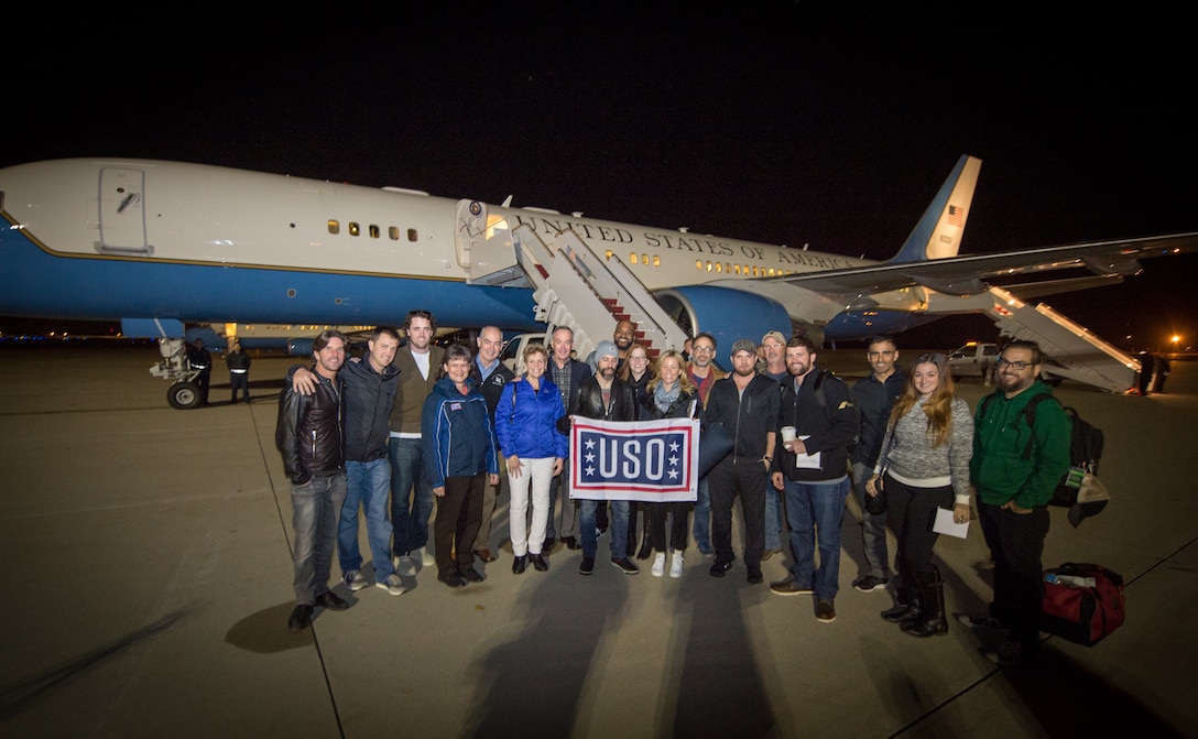 U.S. Marine Corps Gen. Joseph F. Dunford Jr., chairman of the Joint Chiefs of Staff, poses for a group photo with the 2015 USO Entertainment Troupe at the start of the 2015 USO Holiday Tour on Joint Base Andrews, Md., Dec. 4, 2015. DoD photo by D. Myles Cullen
