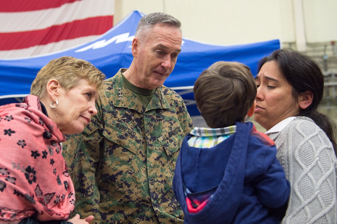 U.S. Marine Corps Gen. Joseph F. Dunford Jr., the chairman of the Joint Chiefs of Staff, and his wife, Ellyn Dunford, meet U.S. service members and their families after a USO show on Naval Air Station Sigonella, Italy, Dec. 5, 2015. The chairman is traveling with entertainers to visit deployed service members during the holidays. DoD photo by D. Myles Cullen