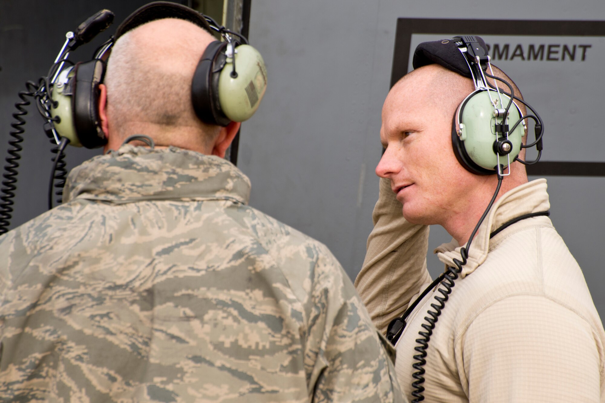 (From Right) U.S. Air Force Master Sgt. Steven Lessard and Tech. Sgt. David Chismark, discuss maintenance issues on the flightline at Little Rock Air Force Base, Ark., Dec. 1, 2015. Both crew chiefs are assigned to the 913th Maintenance Squadron, and always ensure their planes are ready to complete the Air Force’s world-wide missions. (U.S. Air Force photo by Master Sgt. Jeff Walston/Released)  