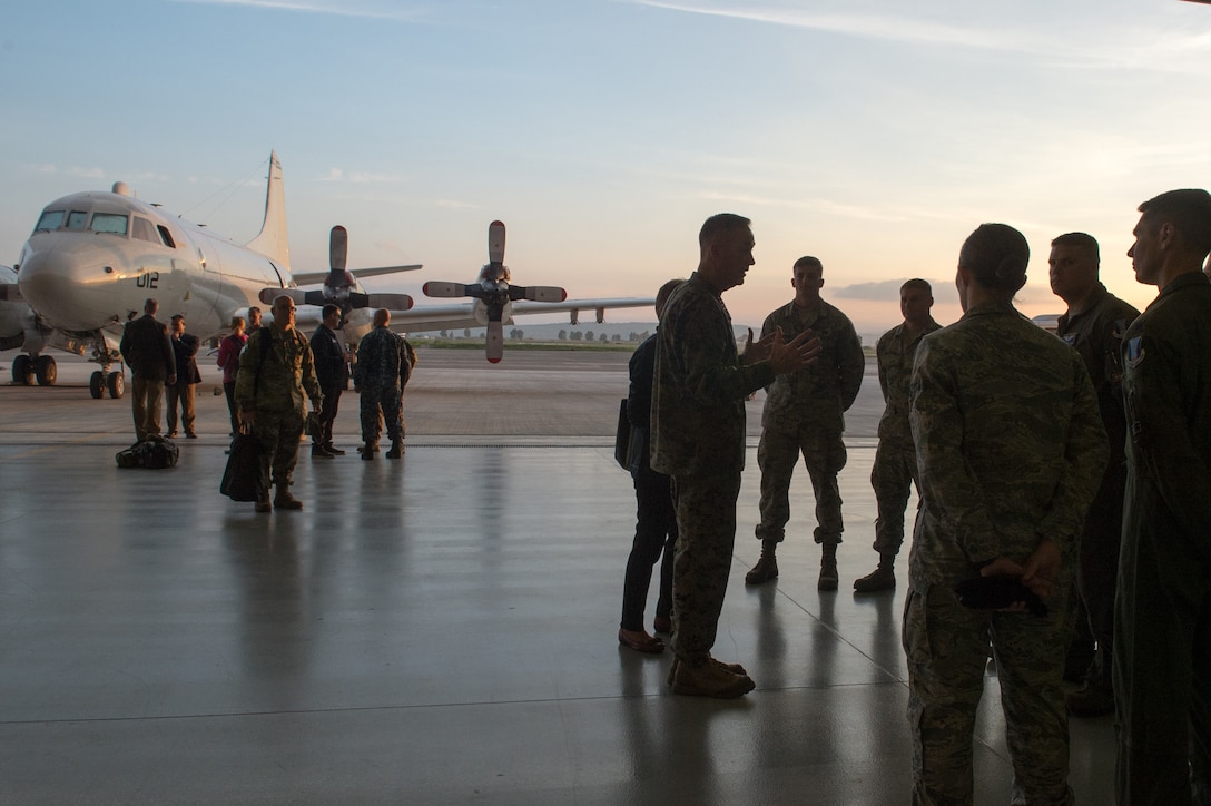 U.S. Marine Corps Gen. Joseph F. Dunford Jr., chairman of the Joint Chiefs of Staff, talks with U.S. airmen on Naval Air Station Sigonella, Italy, Dec. 5, 2015. DoD photo by D. Myles Cullen