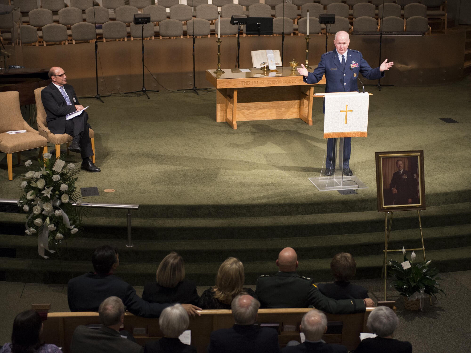 Retired Lt. Gen. James Sherrard, former Air Force Reserve Command commander, speaks to the audience during a memorial ceremony for retired Reserve Brig. Gen. Donald Haugen Dec. 5 at Crosspoint Methodist Church in Niceville, Fla.  The 84-year-old Haugen, who passed away Dec. 1, was the first commander of a 919th designated unit assigned to Duke Field, the 919th Tactical Airlift Group.  The designation still resides there today with the special operations Reserve unit, 919th Special Operations Wing, still resides there today.  Many of the tactical airlift capabilities that began under his leadership are still part of the current 919th SOW mission.  (U.S. Air Force photo/Tech. Sgt. Jasmin Taylor)