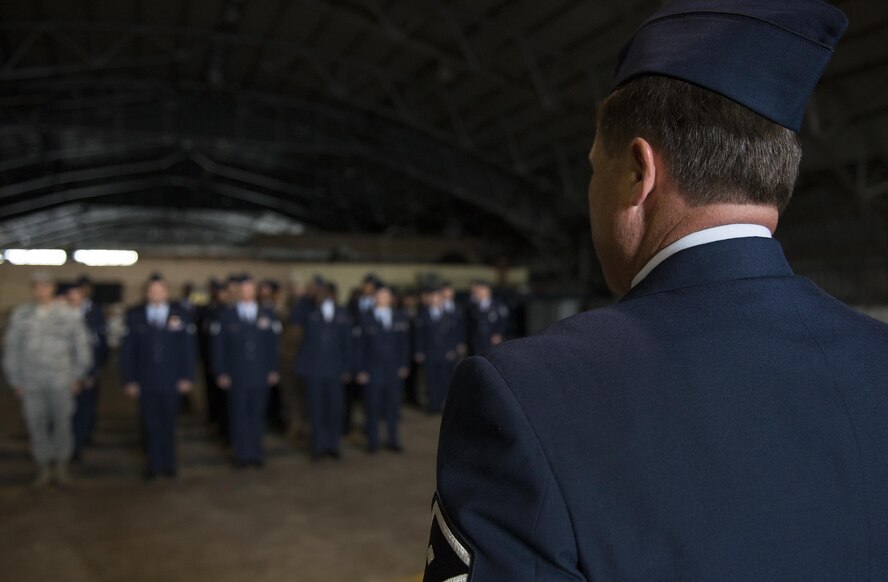 Master Sgt. Glenn Brackin, 919th Special Operations Civil Engineer Squadron first sergeant, orders Airmen into formation prior to an open ranks inspection Dec. 5 at Duke Field, Fla.  The goal of the inspection is for the Airmen to ensure their service dress and appearance conform to Air Force standards.  (U.S. Air Force photo/Tech. Sgt. Sam King)