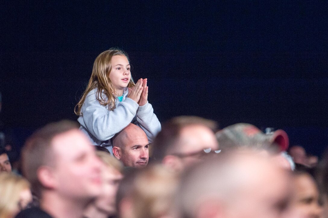A child watches a USO holiday show on Naval Air Station Sigonella, Italy, Dec. 5, 2015. DoD photo by D. Myles Cullen