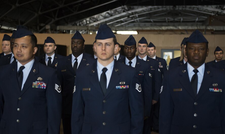 Airmen of the 919th Special Operations Civil Engineer Squadron stand at attention prior to an open ranks inspection Dec. 5 at Duke Field, Fla.  The goal of the inspection is for the Airmen to ensure their service dress and appearance conform to Air Force standards.  (U.S. Air Force photo/Tech. Sgt. Sam King)