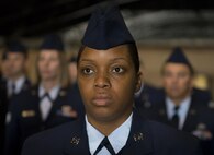 Senior Airman Shaniqua Johnson, 919th Special Operations Civil Engineer Squadron, stands at attention prior to an open ranks inspection Dec. 5 at Duke Field, Fla.  The goal of the inspection is for the Airmen to ensure their service dress and appearance conform to Air Force standards.  (U.S. Air Force photo/Tech. Sgt. Sam King)