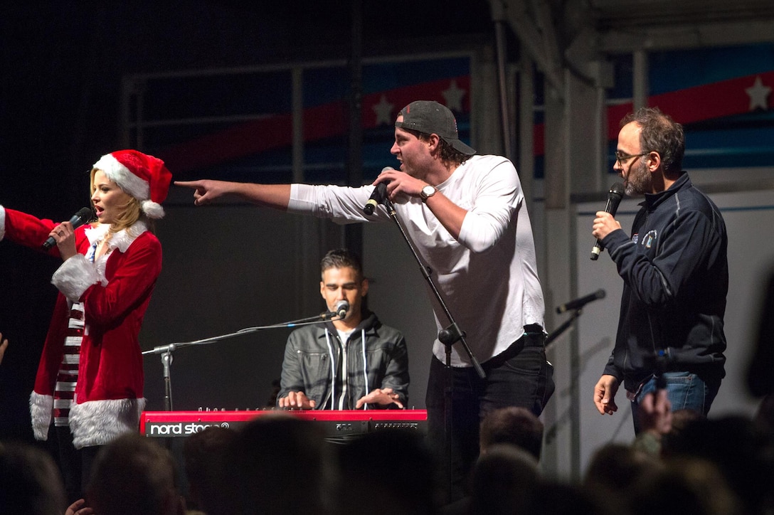 Boston Red Sox pitcher Steven Wright, center right, speaks to U.S. troops and their family members during a USO show on Naval Air Station Sigonella, Italy, Dec. 5, 2015. DoD photo by D. Myles Cullen