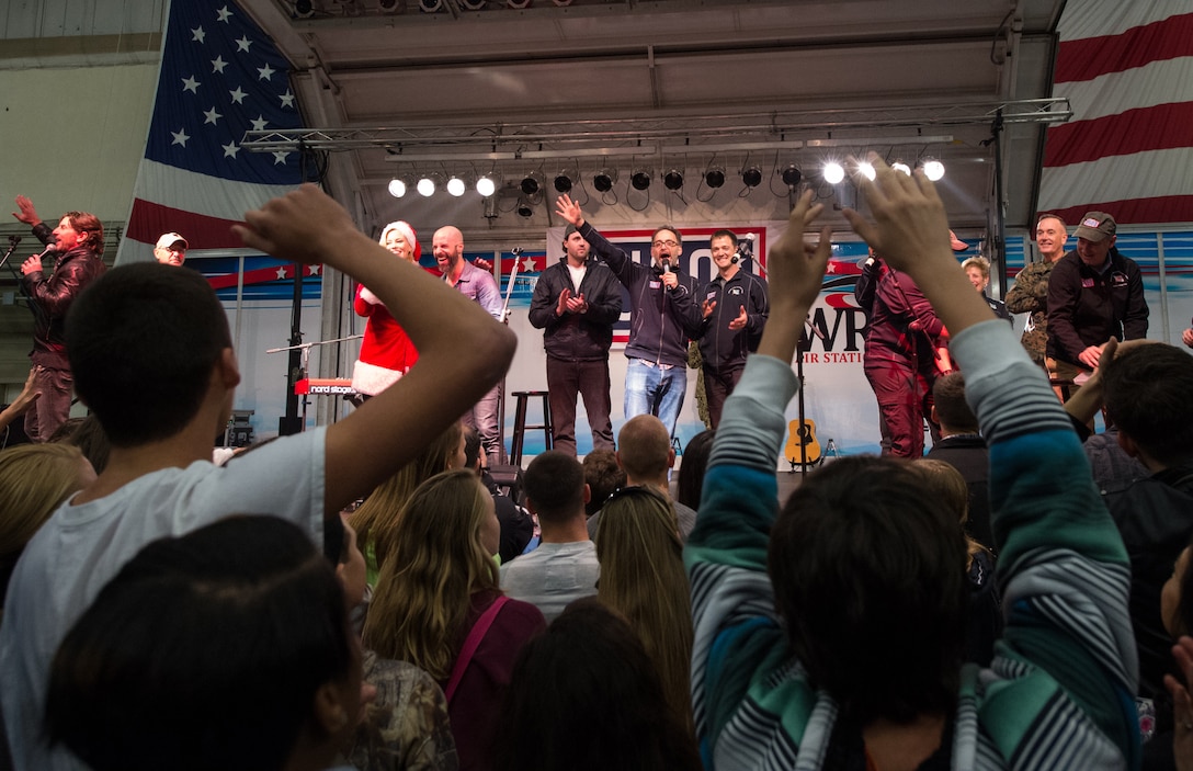 U.S. Marine Corps Gen. Joseph F. Dunford Jr., second from right, chairman of the Joint Chiefs of Staff, joins performers on stage at the conclusion of a USO show on Naval Air Station Sigonella, Italy, Dec. 5, 2015. DoD photo by D. Myles Cullen