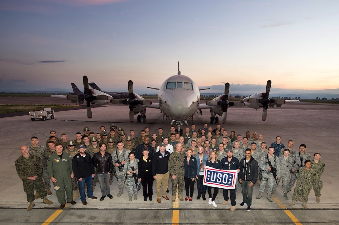 U.S. Marine Corps Gen. Joseph F. Dunford Jr., chairman of the Joint Chiefs of Staff, takes a photo with members of the 2015 USO Entertainment Troupe and U.S. service members on Naval Air Station Sigonella, Italy, Dec. 5, 2015. DoD photo by D. Myles Cullen