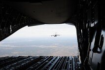 A C-17 Globemaster III aircraft from Joint Base Charleston, SC flies in formation as spouses from the 315th Airlift Wing here enjoy the view during a spouse flight Saturday, Dec. 5. Spouse flights are an opportunity for spouses of Airmen to experience a peek behind the curtain of what their loved ones do during their monthly unit training assembly weekends and annual tour committment. (U.S. Air Force photo by Staff Sgt. Bobby Pilch)