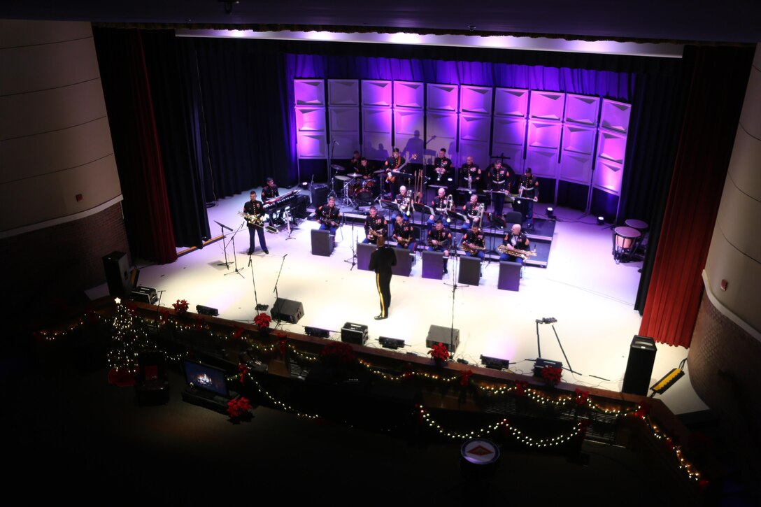Members of the 2nd Marine Aircraft Wing band perform on stage during the annual Christmas concert at Marine Corps Air Station Cherry Point, N.C., Dec. 4, 2015. Audience members shared laughs and cheers with other members of the community while also getting the opportunity to donate to the Toys for Tots foundation. The 2nd MAW band has held the traditional concert at the air station as a way to bring both the military and local community together to unwind and share in the holiday spirit. (U.S. Marine Corps photo by Cpl. N.W. Huertas/Released)
